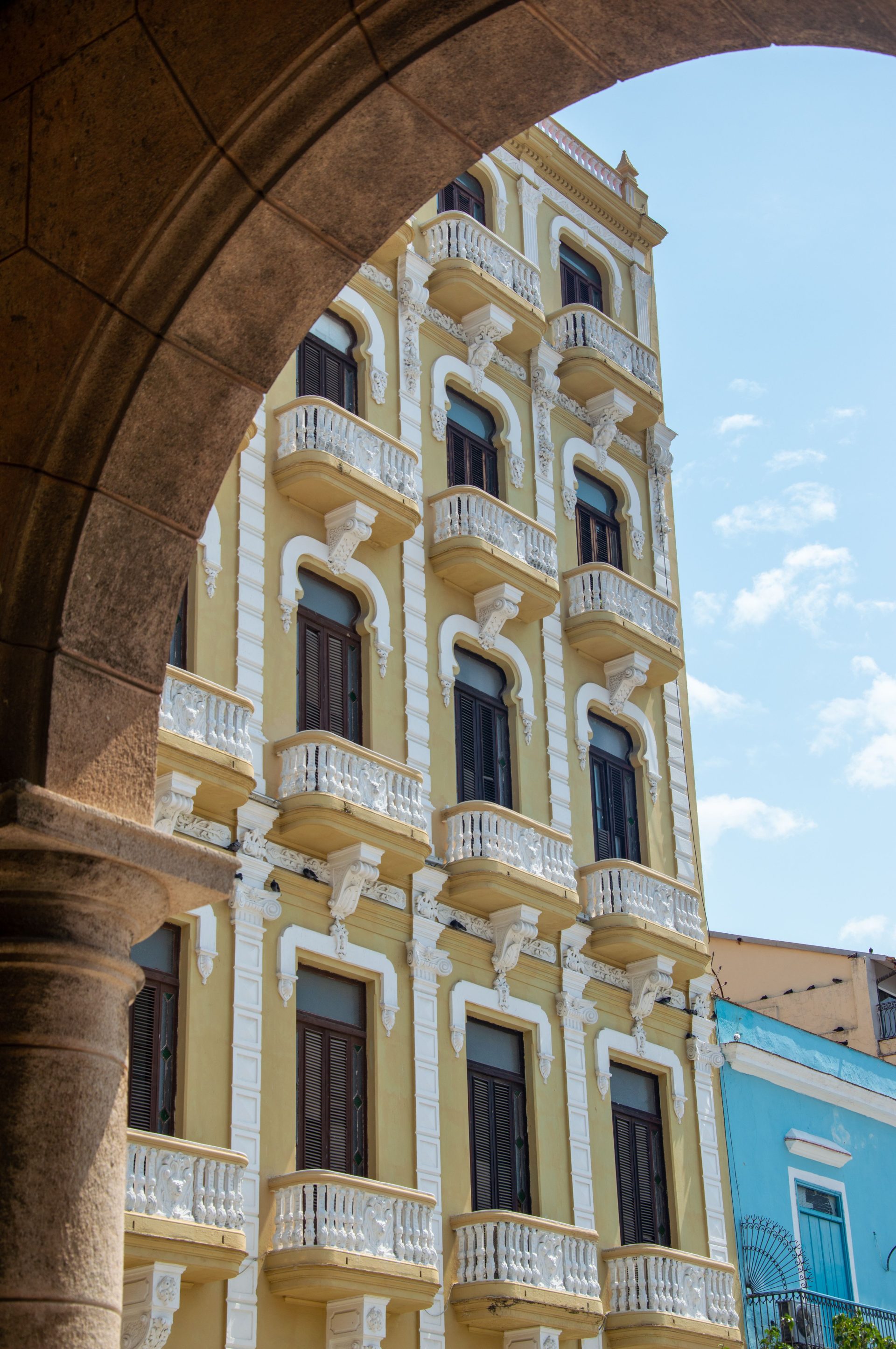 An ornate balcony facade on a Havana street