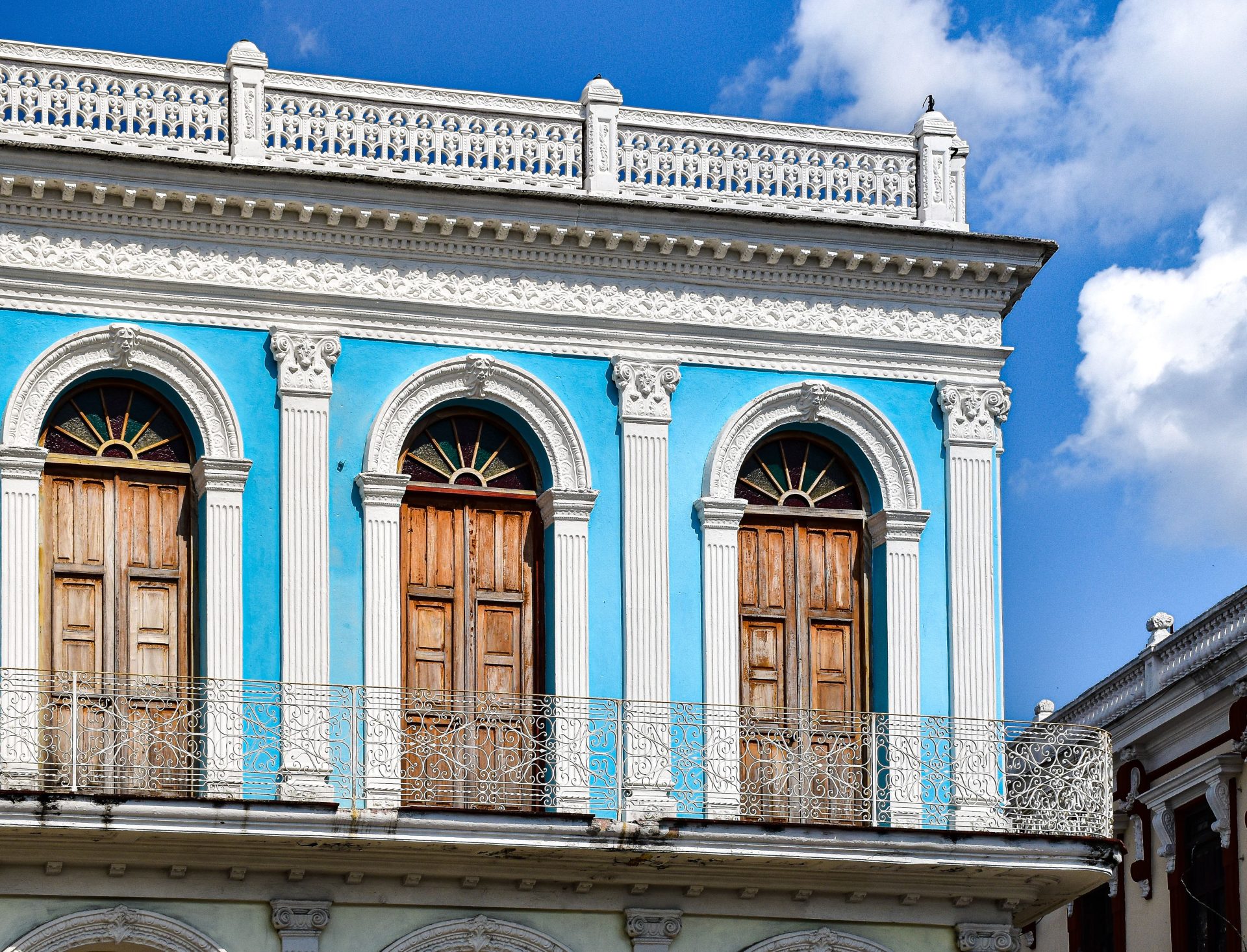 A vibrant colonial building facade with columns