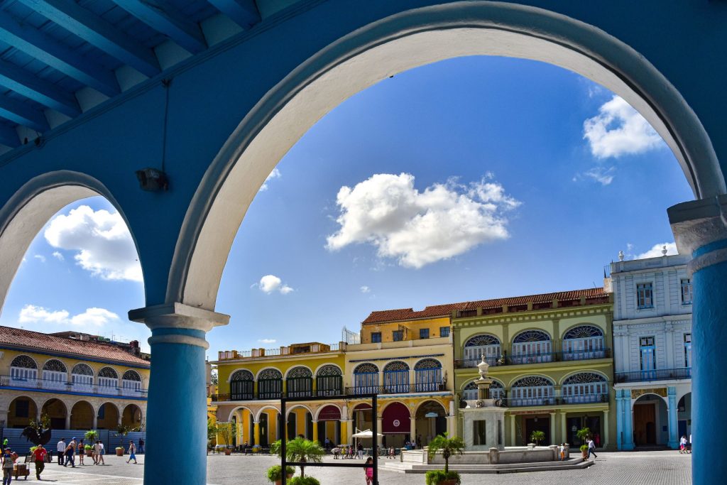 Vibrant colonial architecture at Plaza Vieja, Havana, showcasing historic Cuban charm.