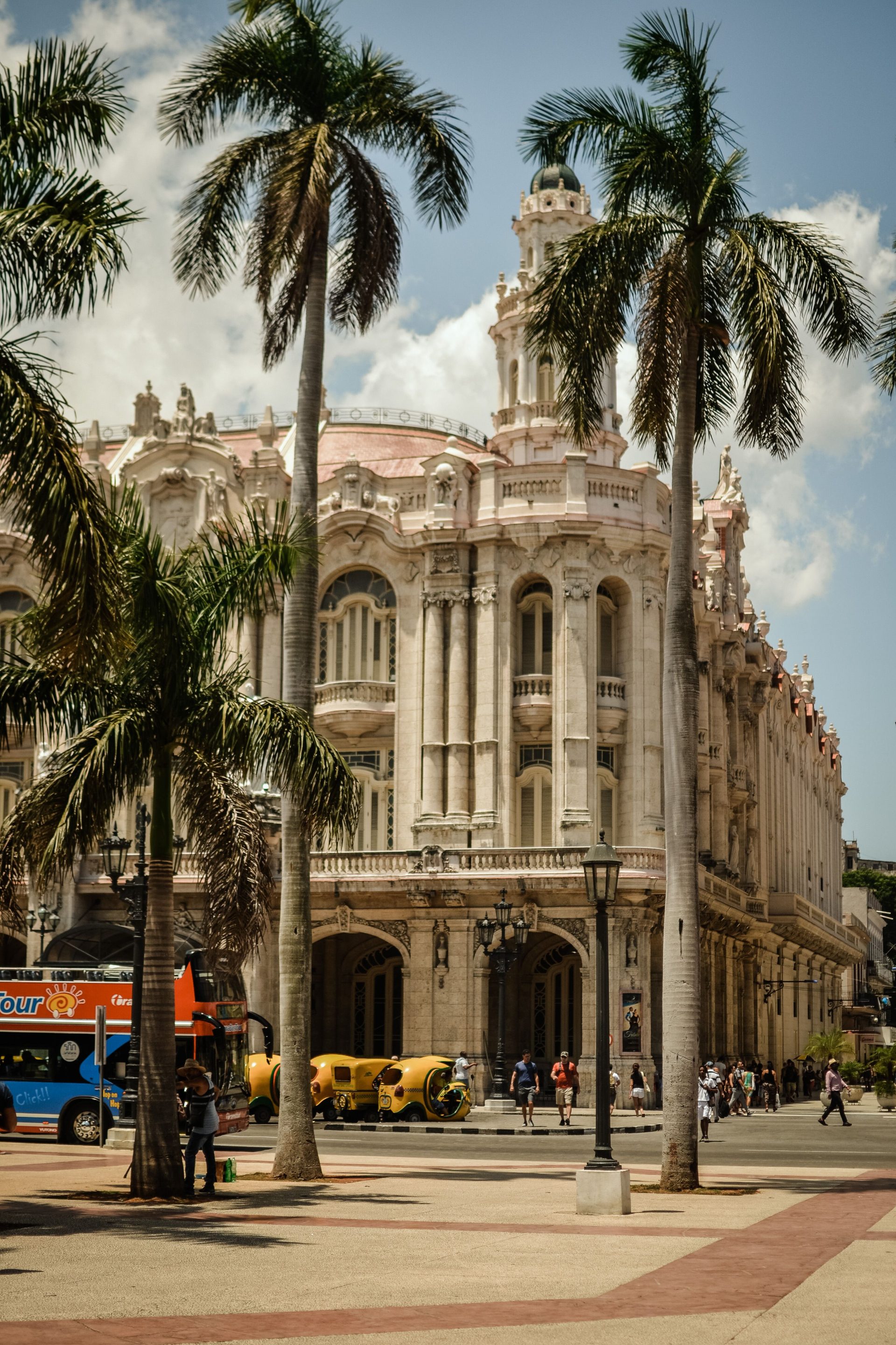 A grand white neoclassical building in central Havana