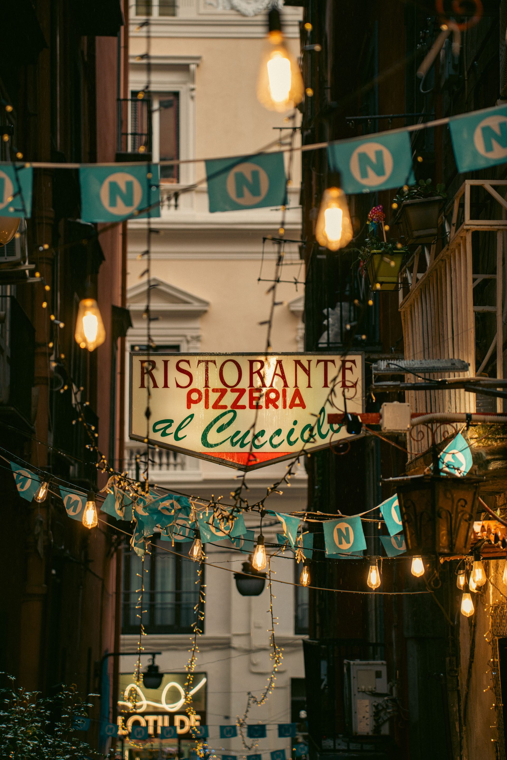 Roman trattoria dining room in Rome with warm tables and traditional atmosphere