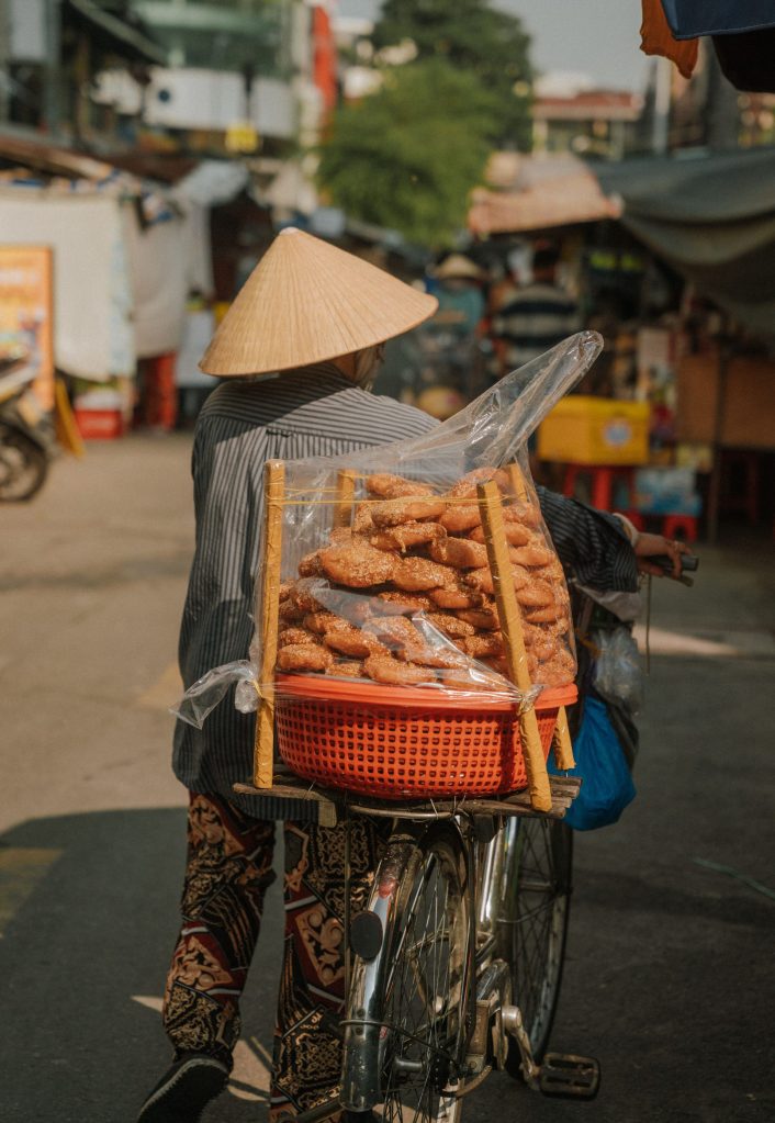 Ho Chi Minh City street food market with Vietnamese dishes and local diners