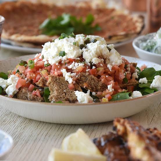 Sfakiani pita, cheese-filled flatbread drizzled with honey