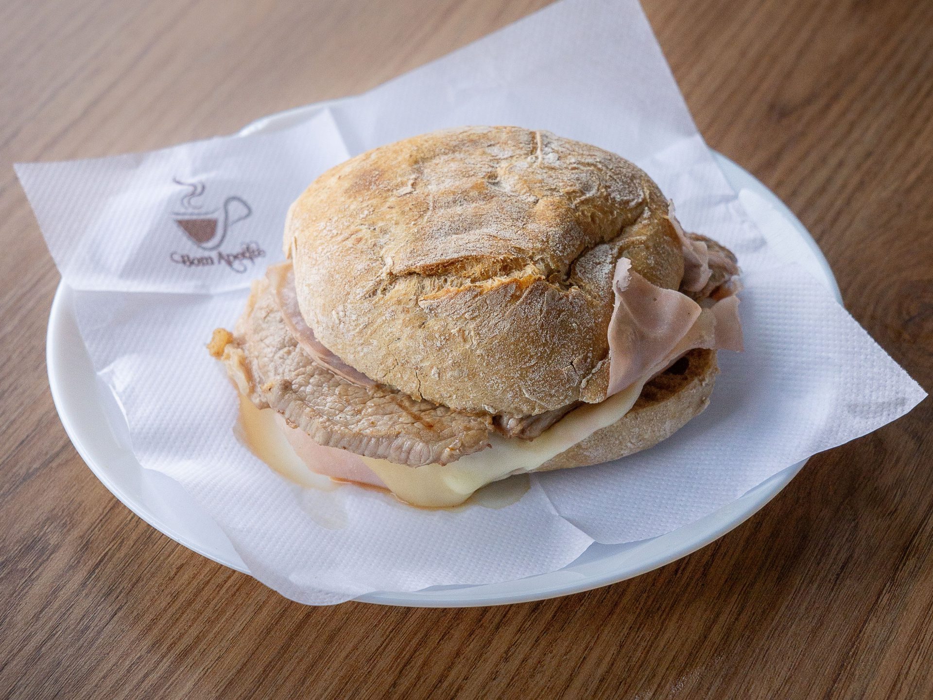 A prego steak sandwich on a crusty roll