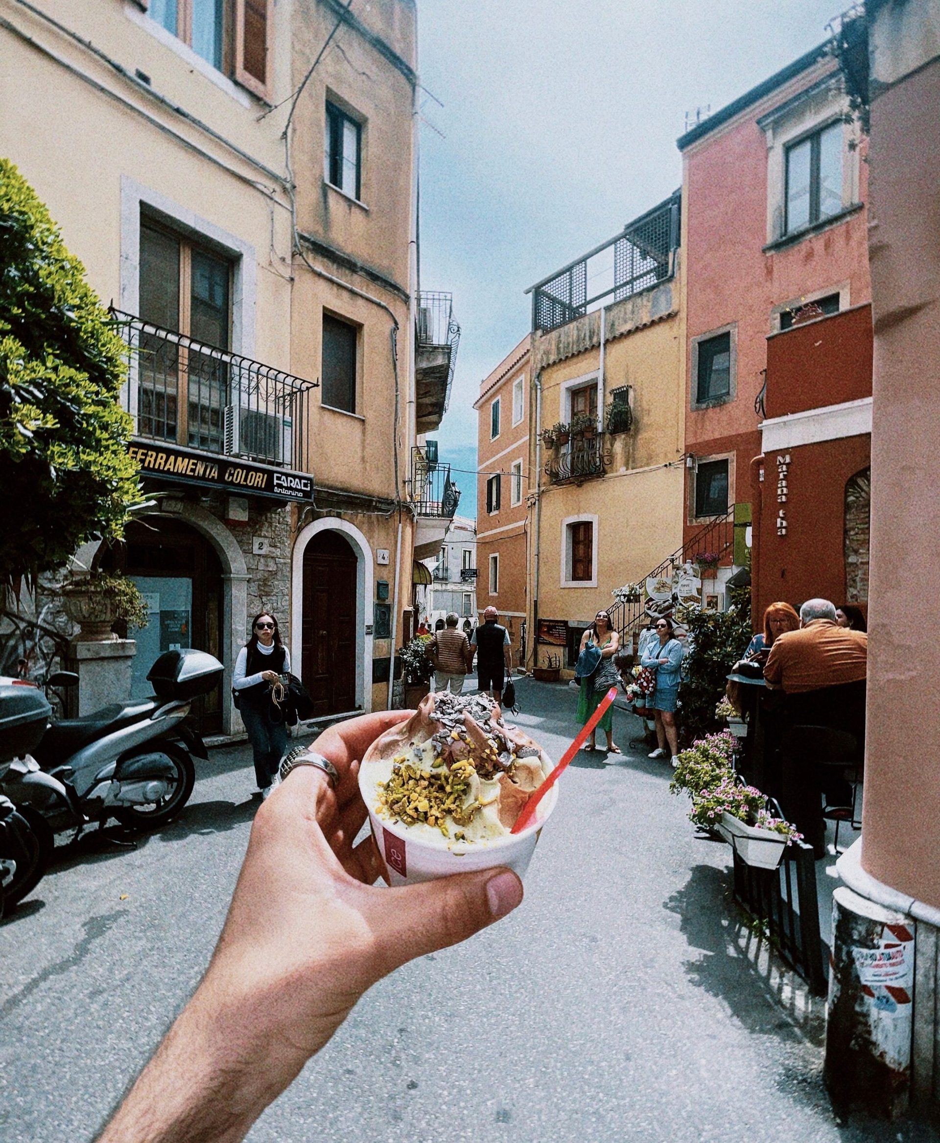 Gelato stored in covered metal tins at a Roman gelateria
