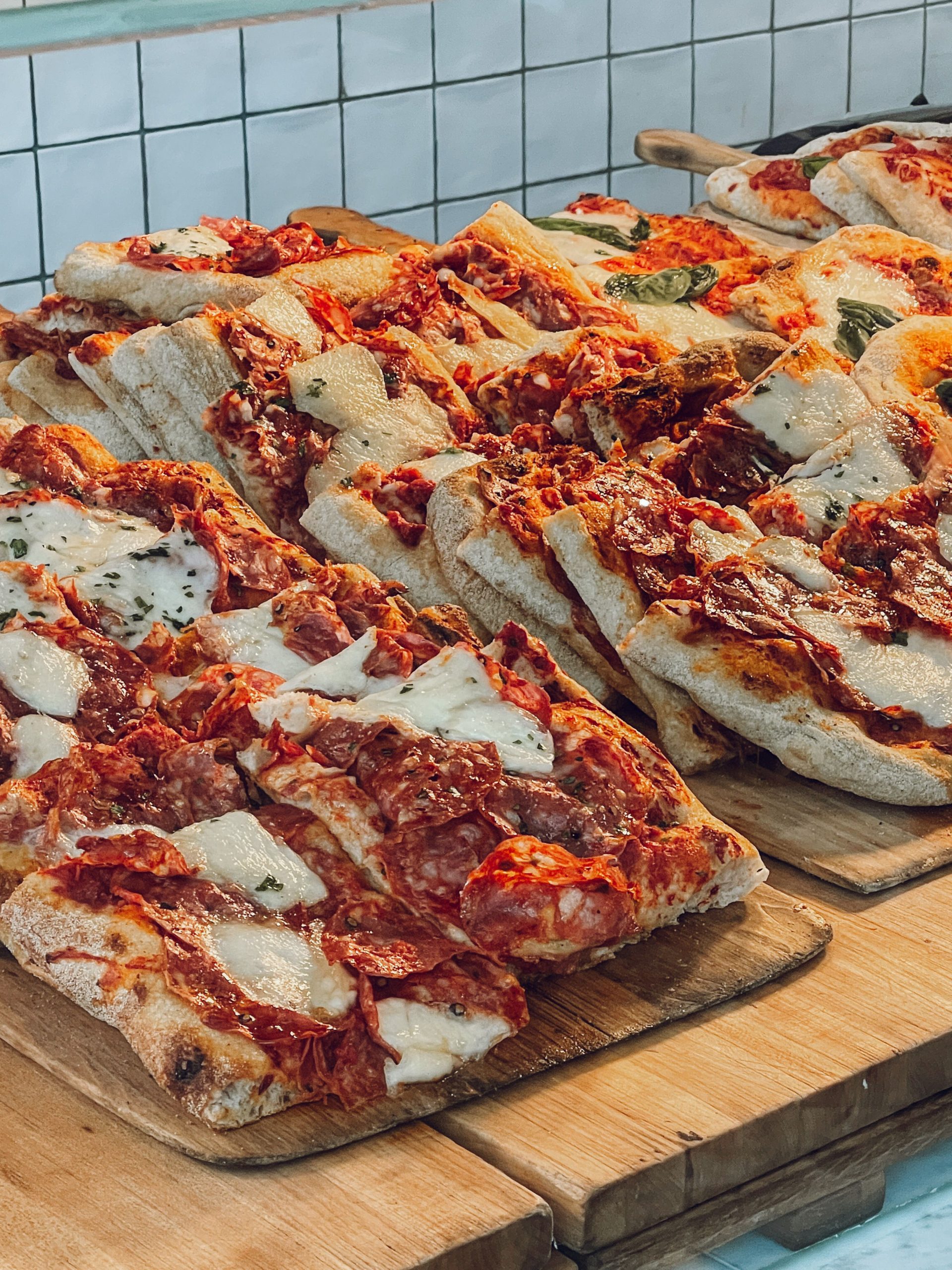 A thin crisp Roman pizza tonda fresh from a wood-fired oven