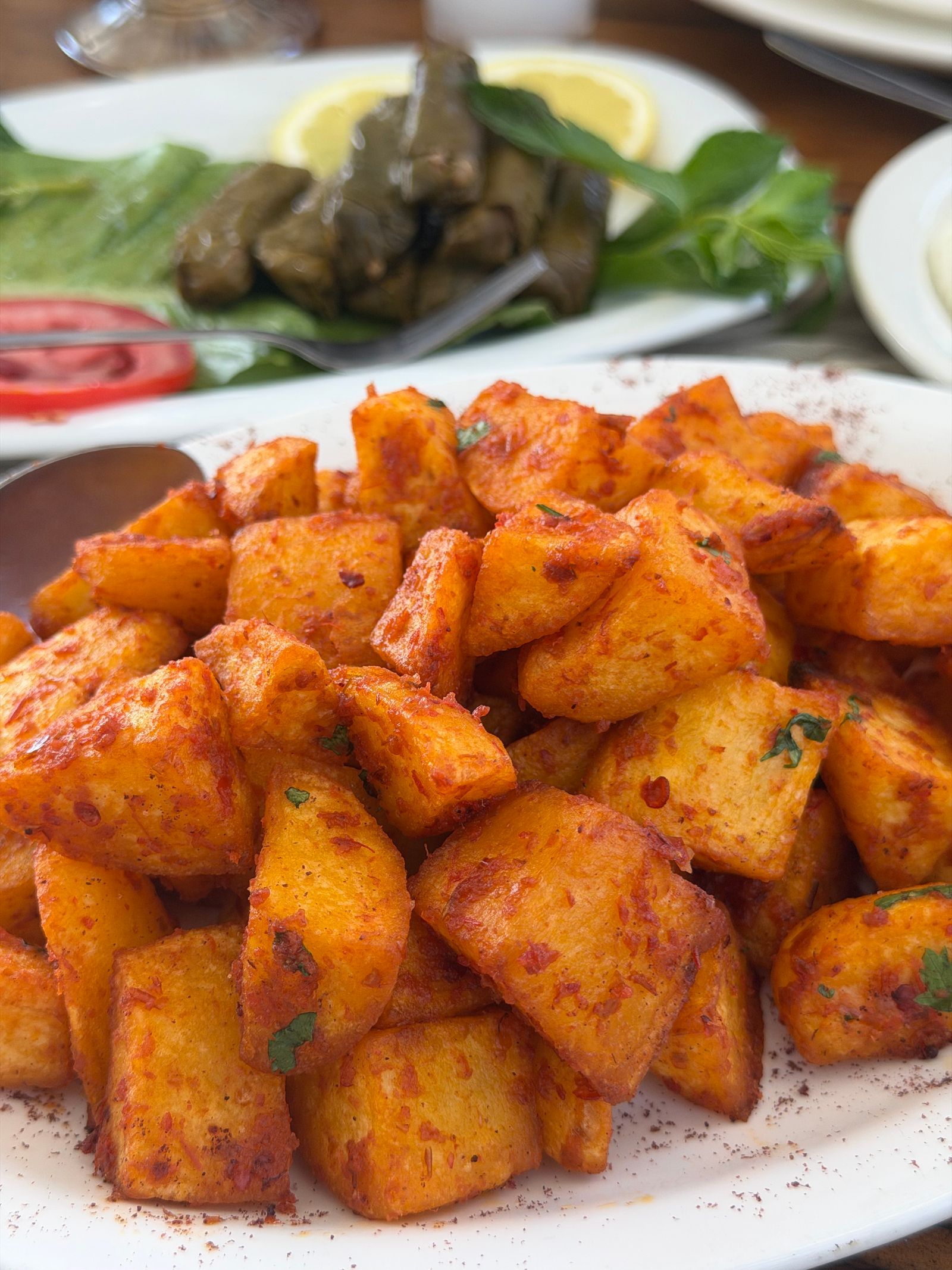 Crisp fried potato cubes with spiced brava sauce, the Barcelona bomba style