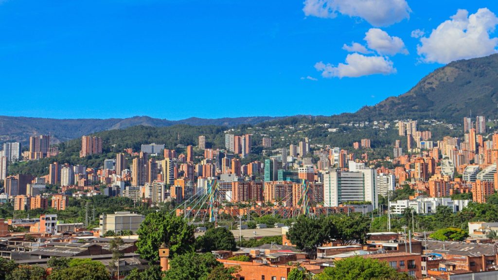Medellin spread across the Aburra Valley with mountains rising behind it