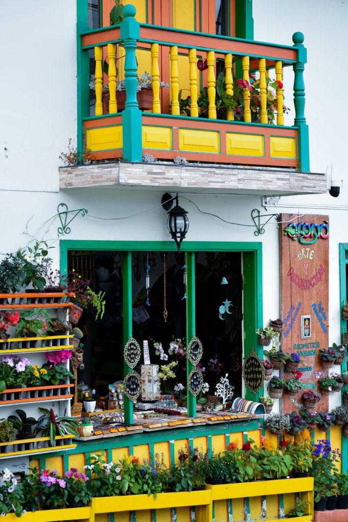 A brightly painted balcony in yellow, green and red in Filandia, Colombia