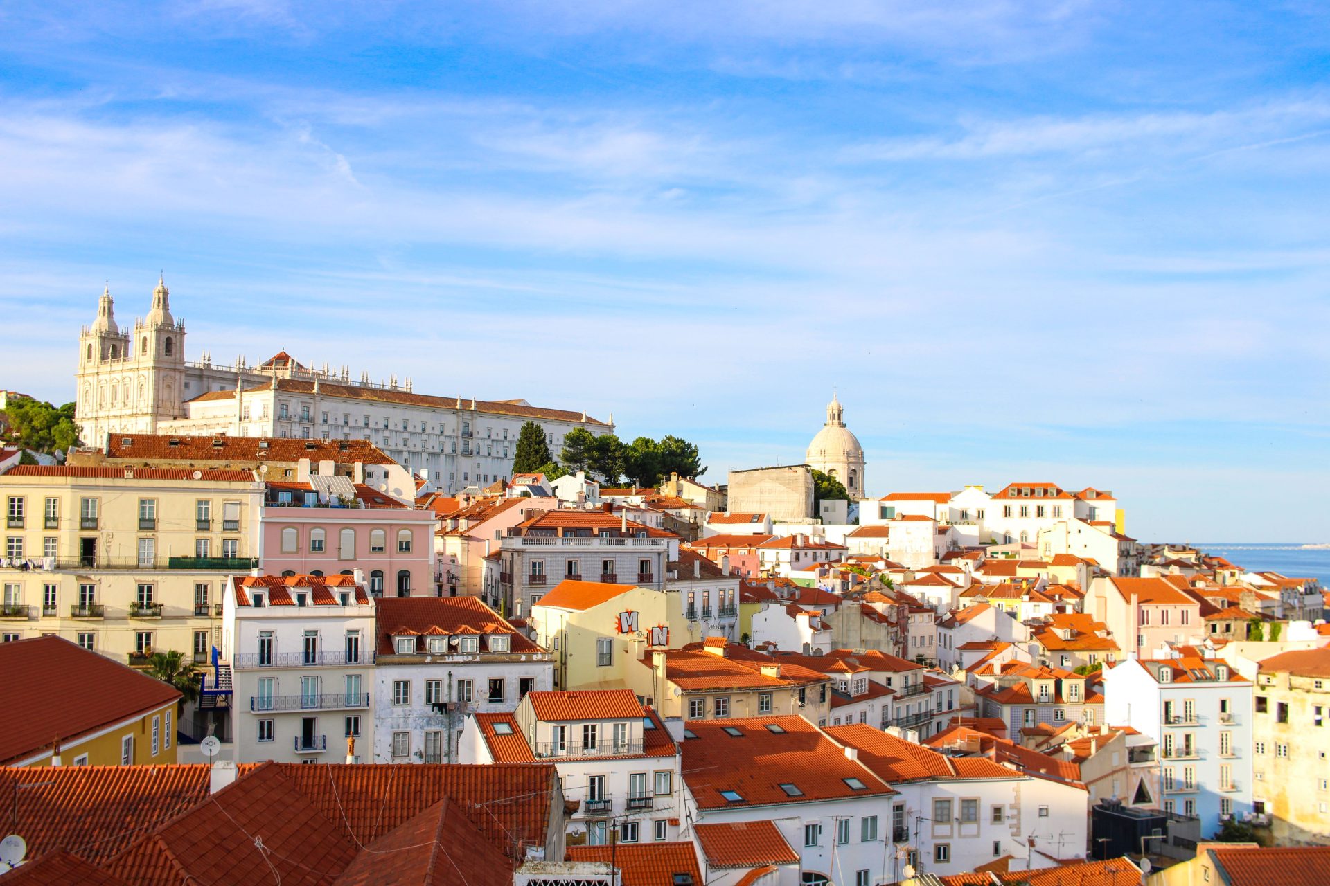 The Alfama skyline with the white towers of a church