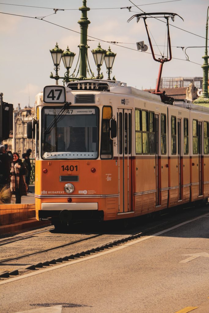 A yellow number 47 tram on a Budapest street
