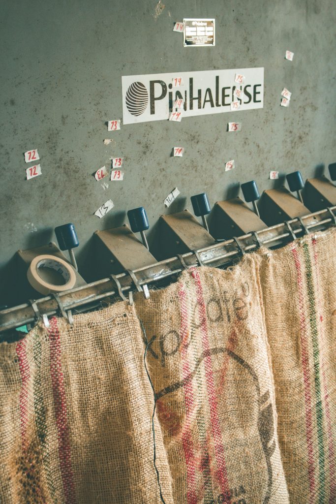Burlap coffee sacks hanging on the wall of a Colombian finca