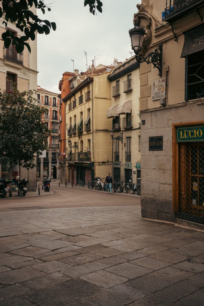 An empty cobbled square in La Latina at dusk