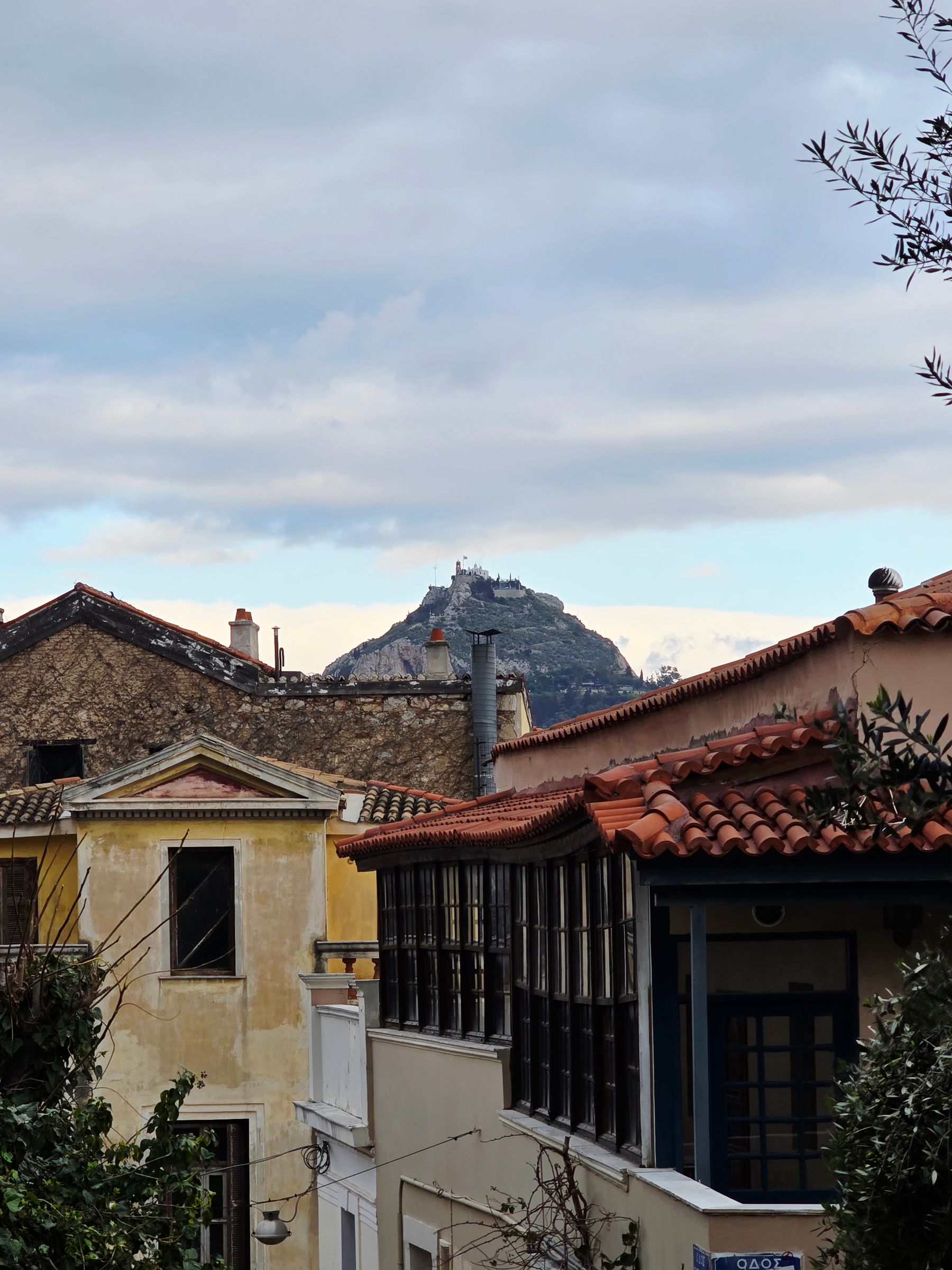 Lycabettus Hill seen over the tiled roofs of central Athens