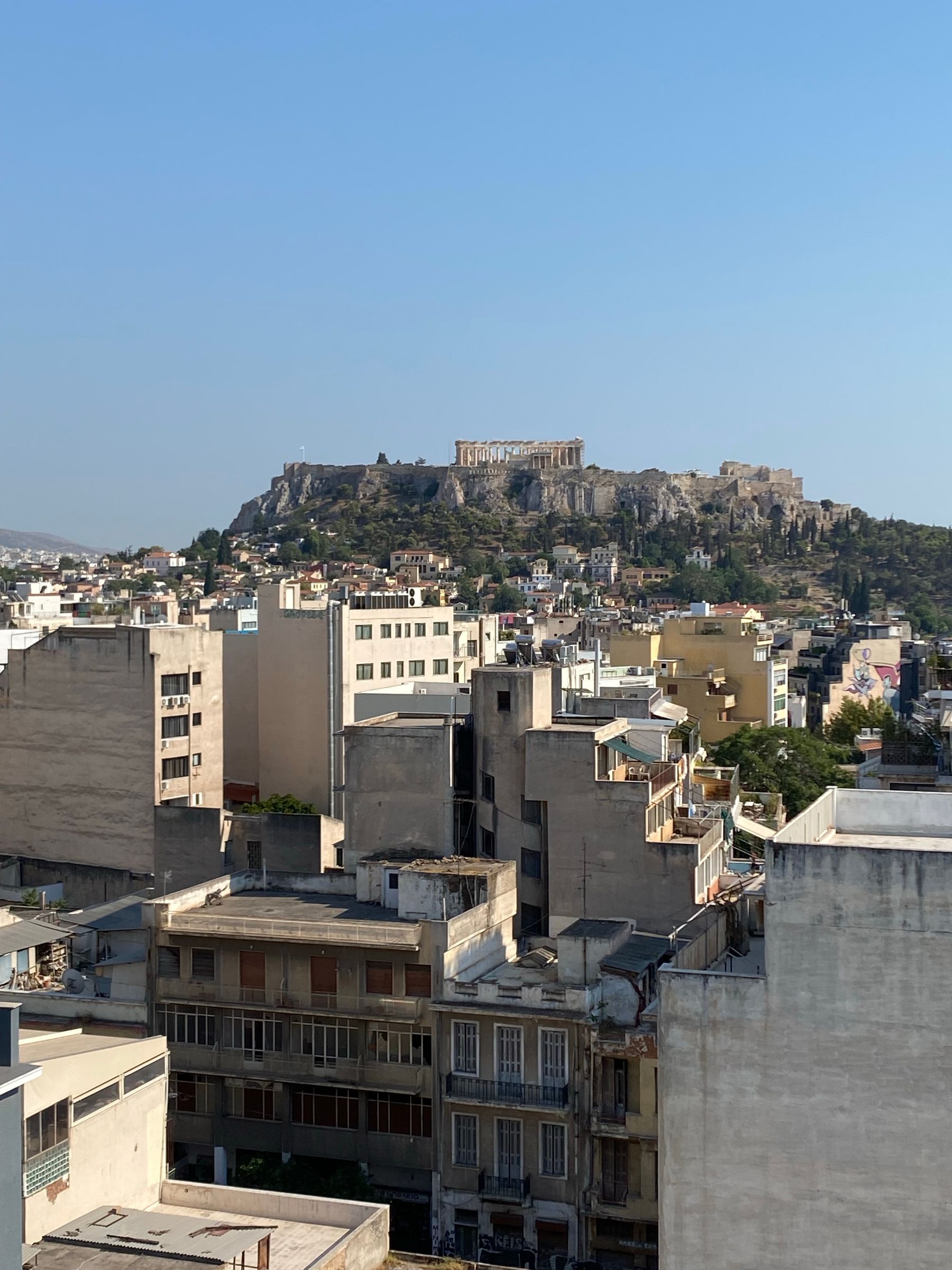 A rooftop view across Athens apartment blocks