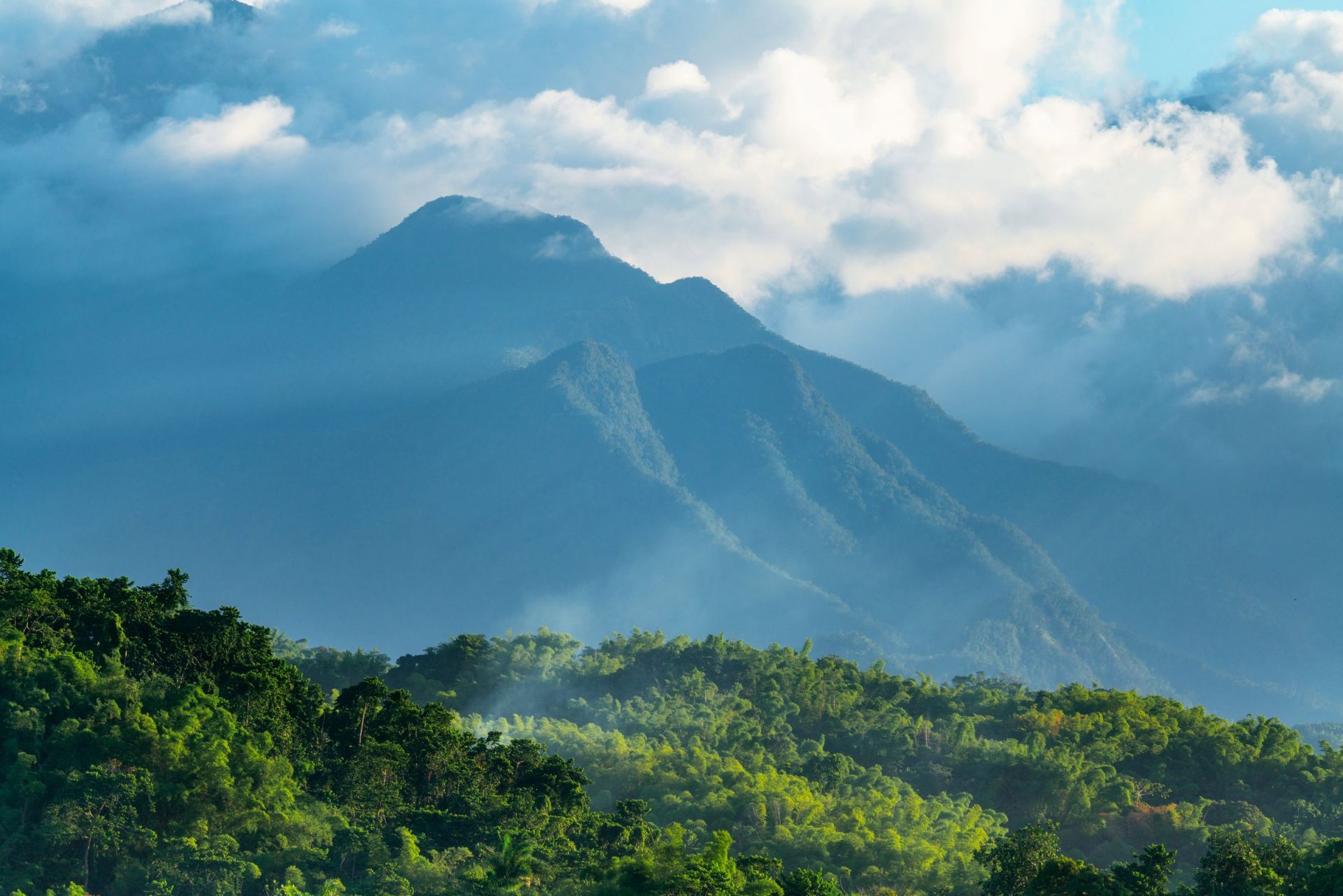 The Blue Mountains of Jamaica shrouded in cloud and sunlight
