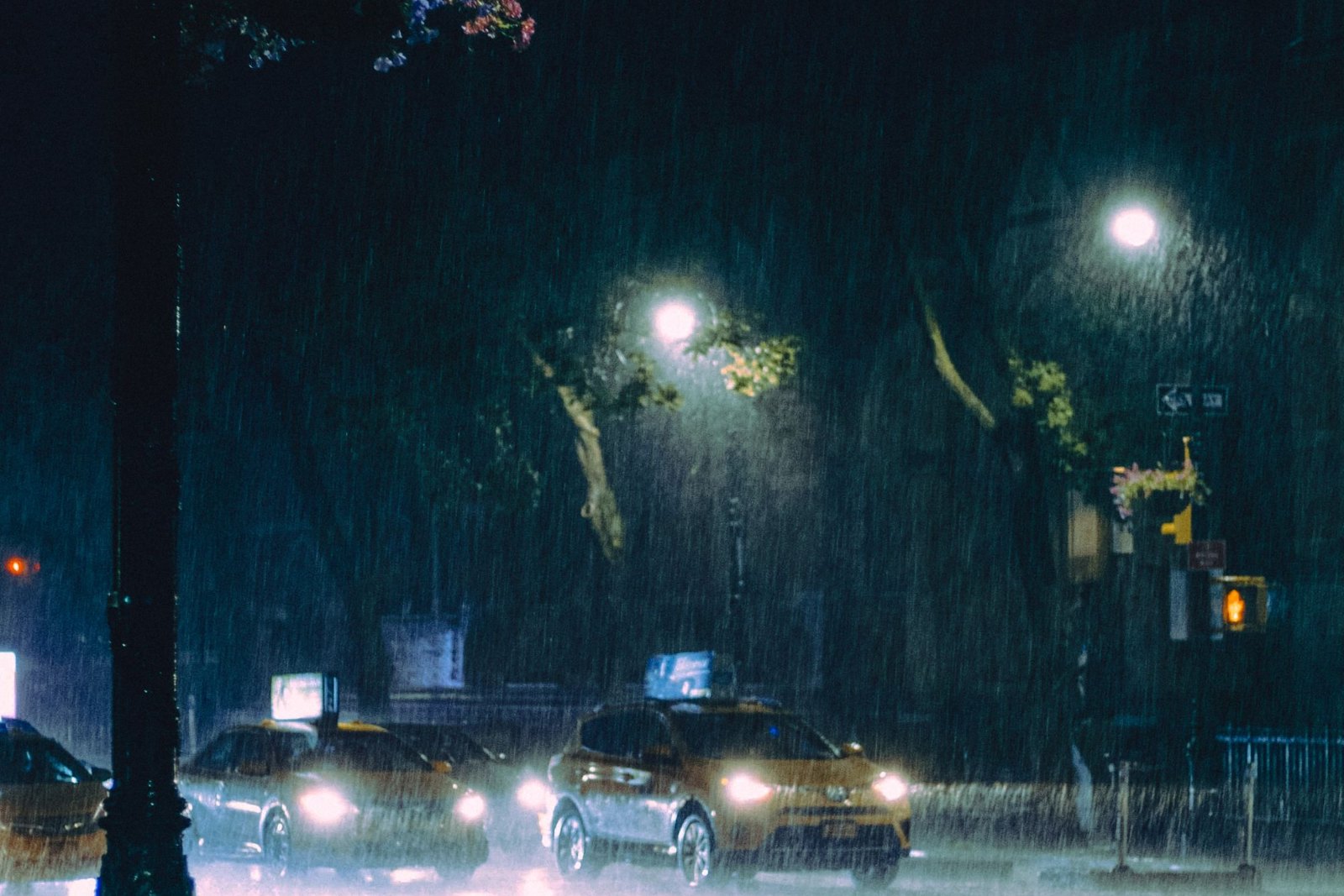 The city after dark, lights reflected on a wet road