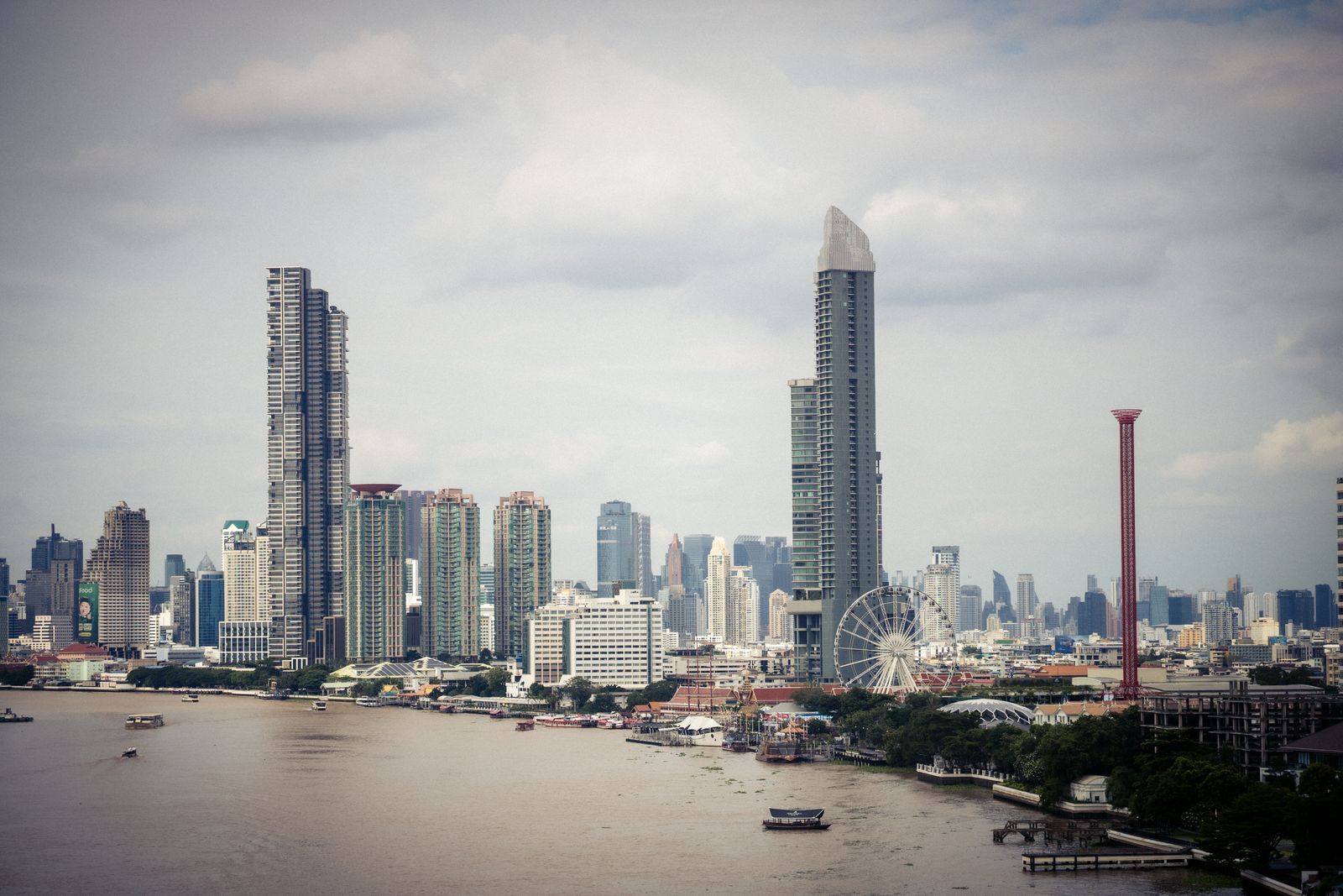 Bangkok's skyline with the riverside Ferris wheel on the Chao Phraya