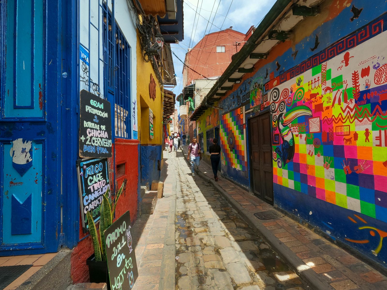 Colourful graffiti in a narrow alley in Bogota