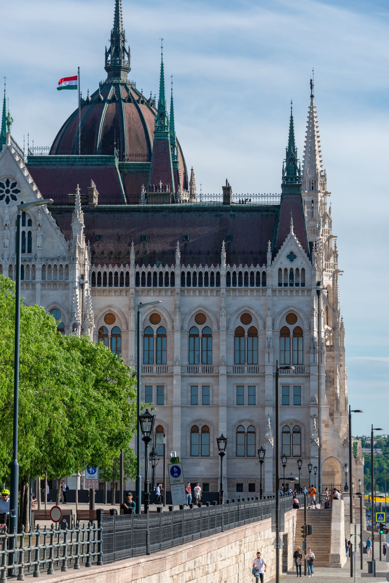 Gothic stonework and spires of the Hungarian Parliament against a clear sky