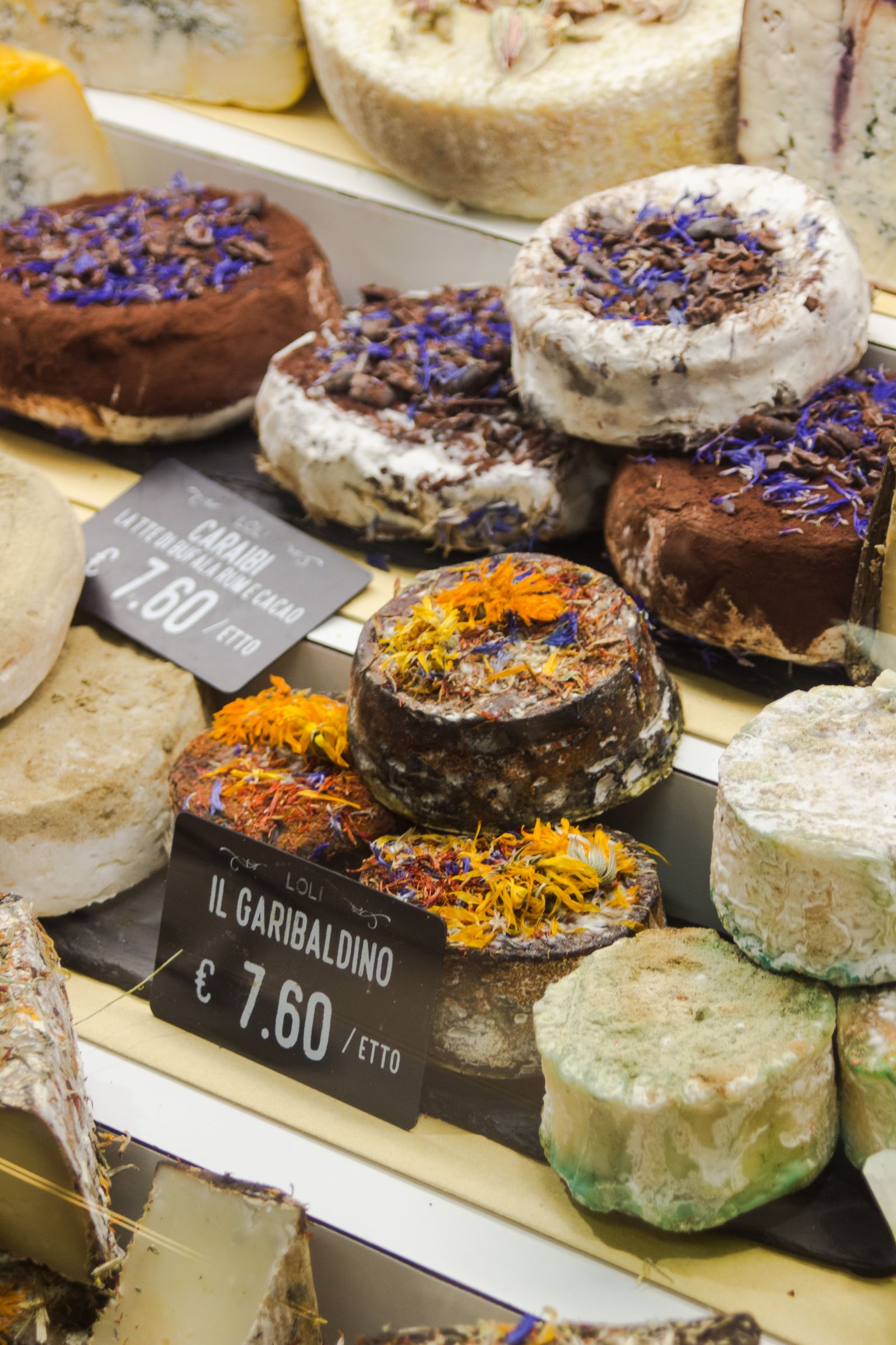 Italian cheeses on display in a Florentine market