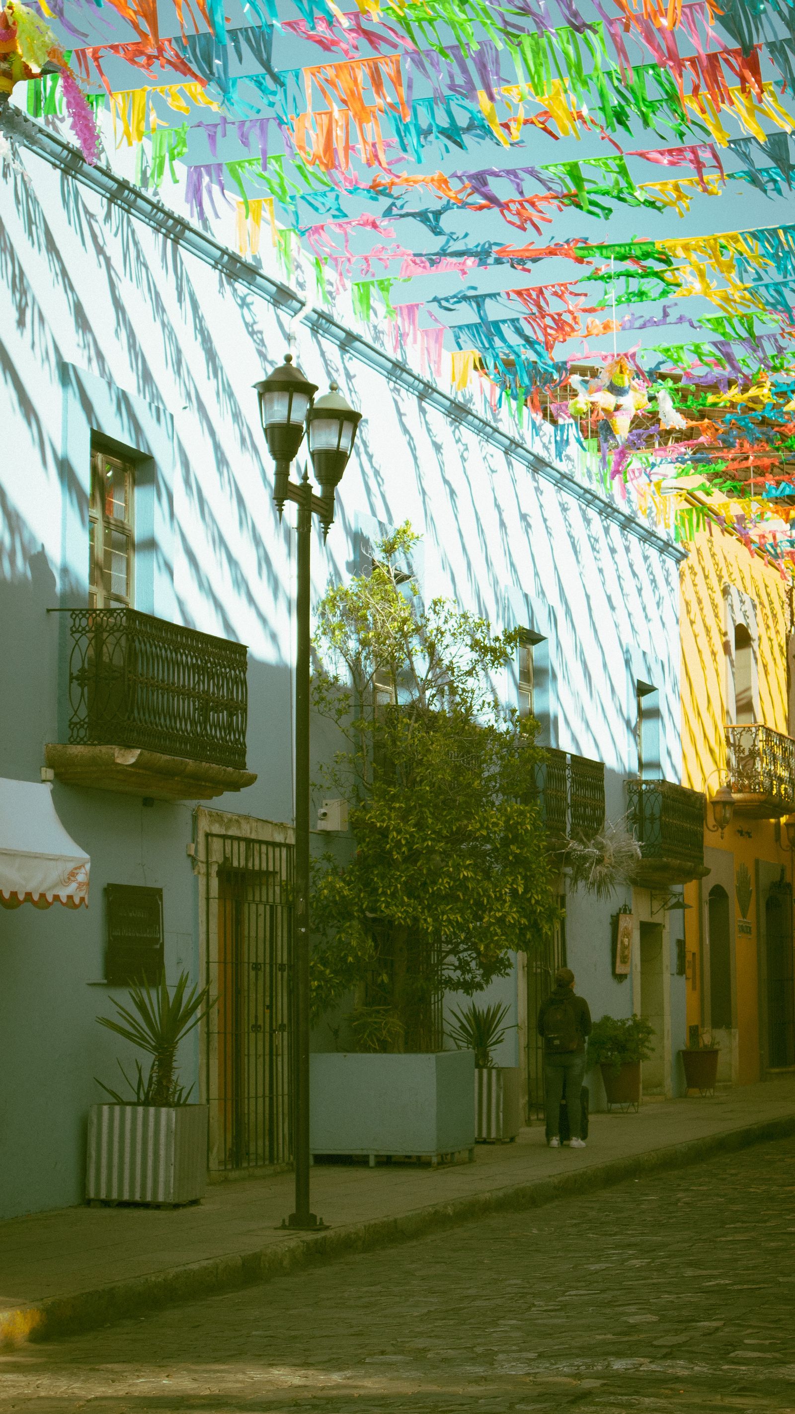 A street in Oaxaca, Mexico hung with colourful flags