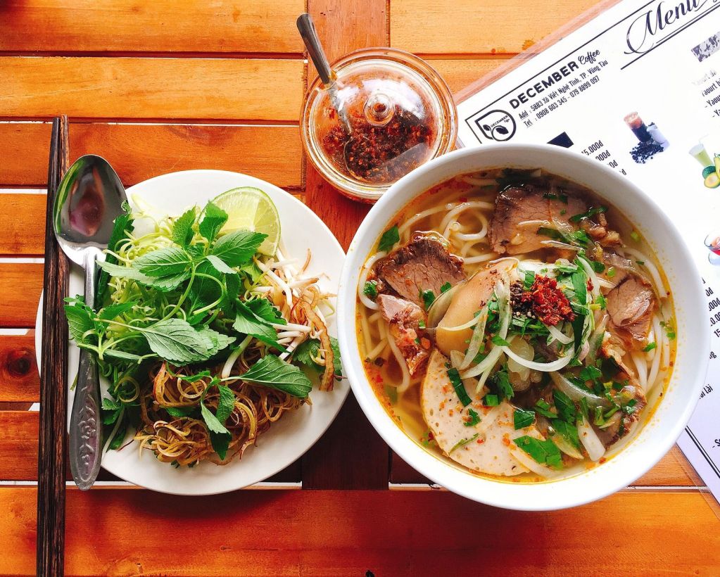 Southeast Asian noodle soups: a Vietnamese noodle bowl with fresh herbs