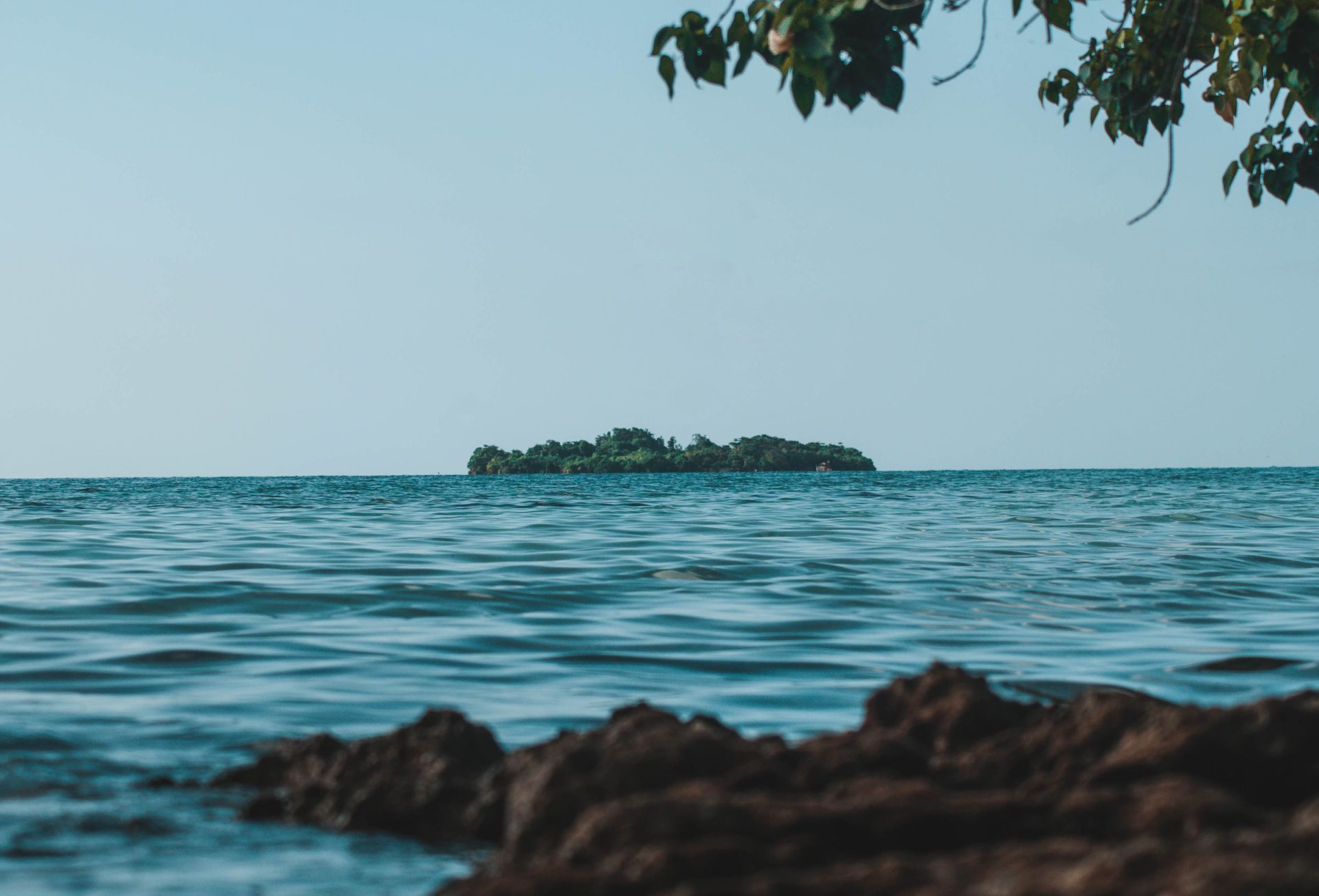 Island view from the coast of Negril, Jamaica under clear skies
