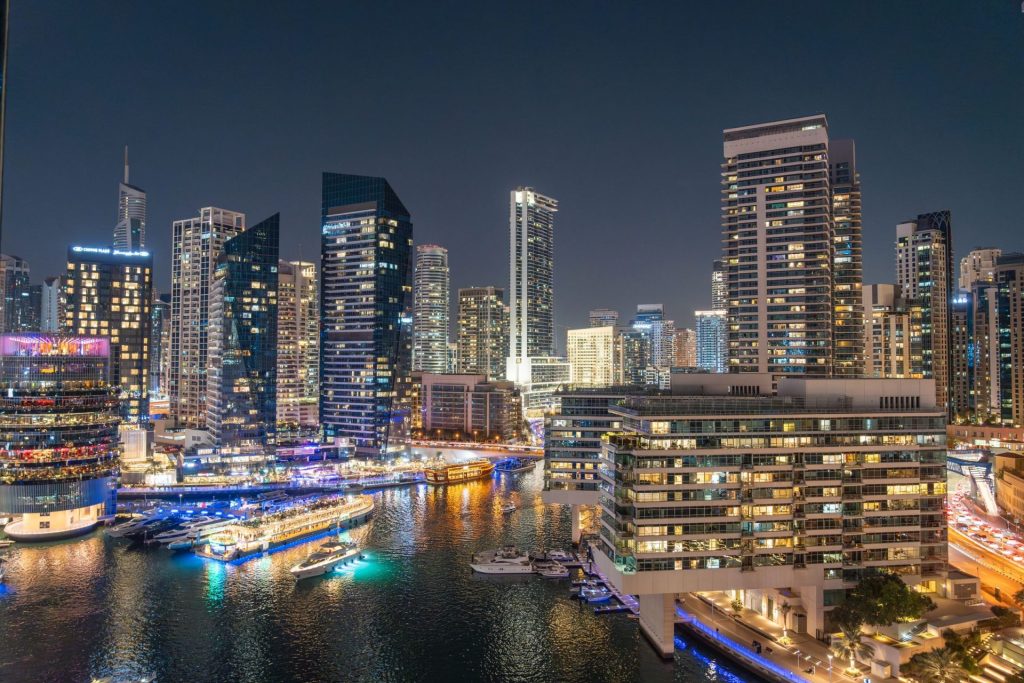 Thailand nightlife in Bangkok: the city skyline illuminated beside the river