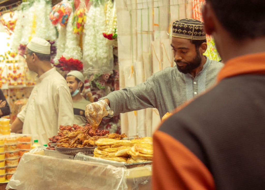 Best food cities in Asia: cooks working at a busy street food stall