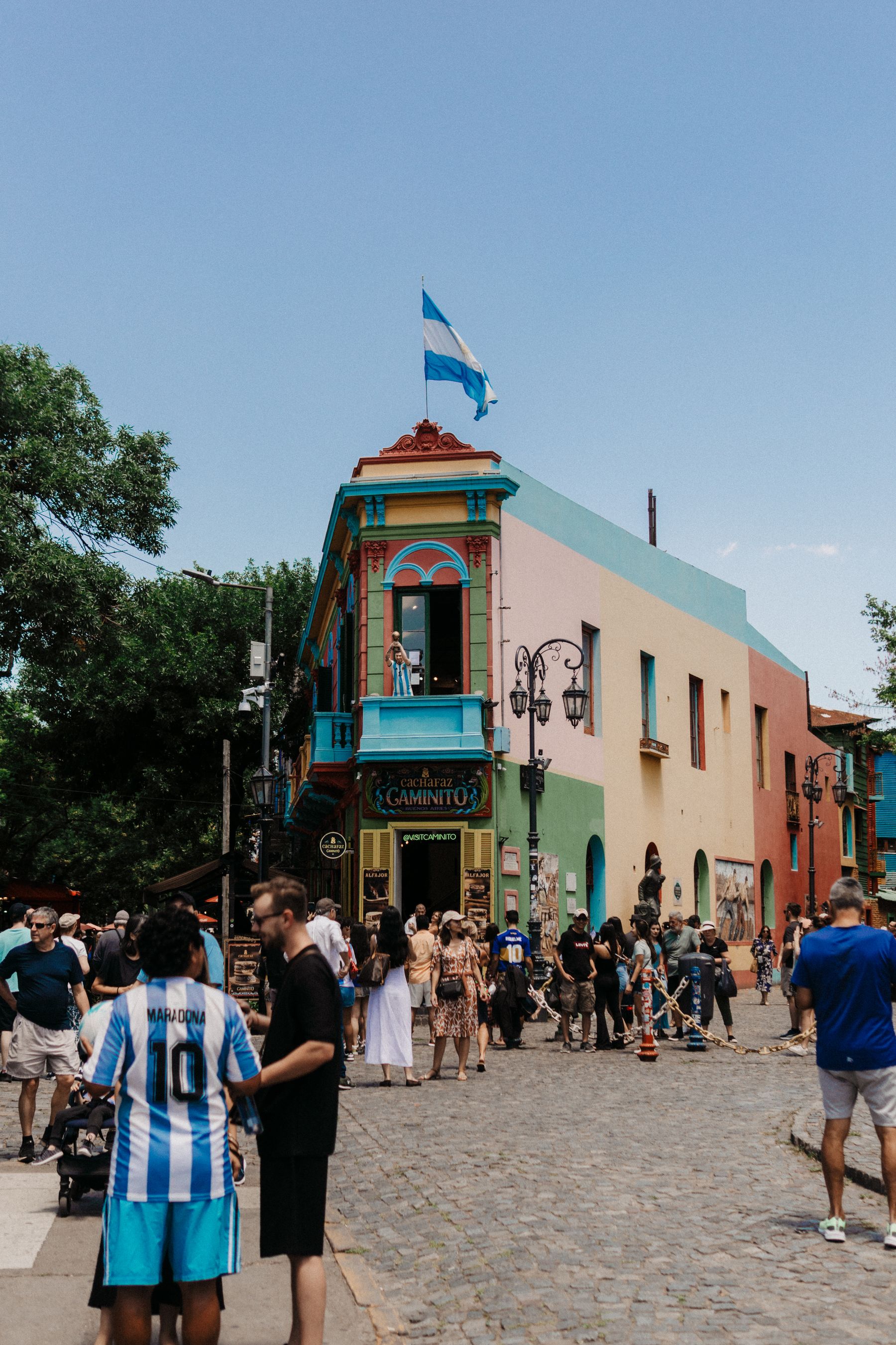 Visitors exploring the brightly painted Caminito street in Buenos Aires