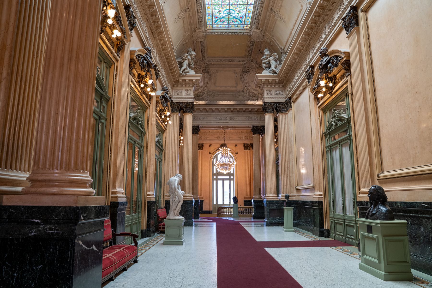 A marble hallway with classic columns inside a historic Buenos Aires building