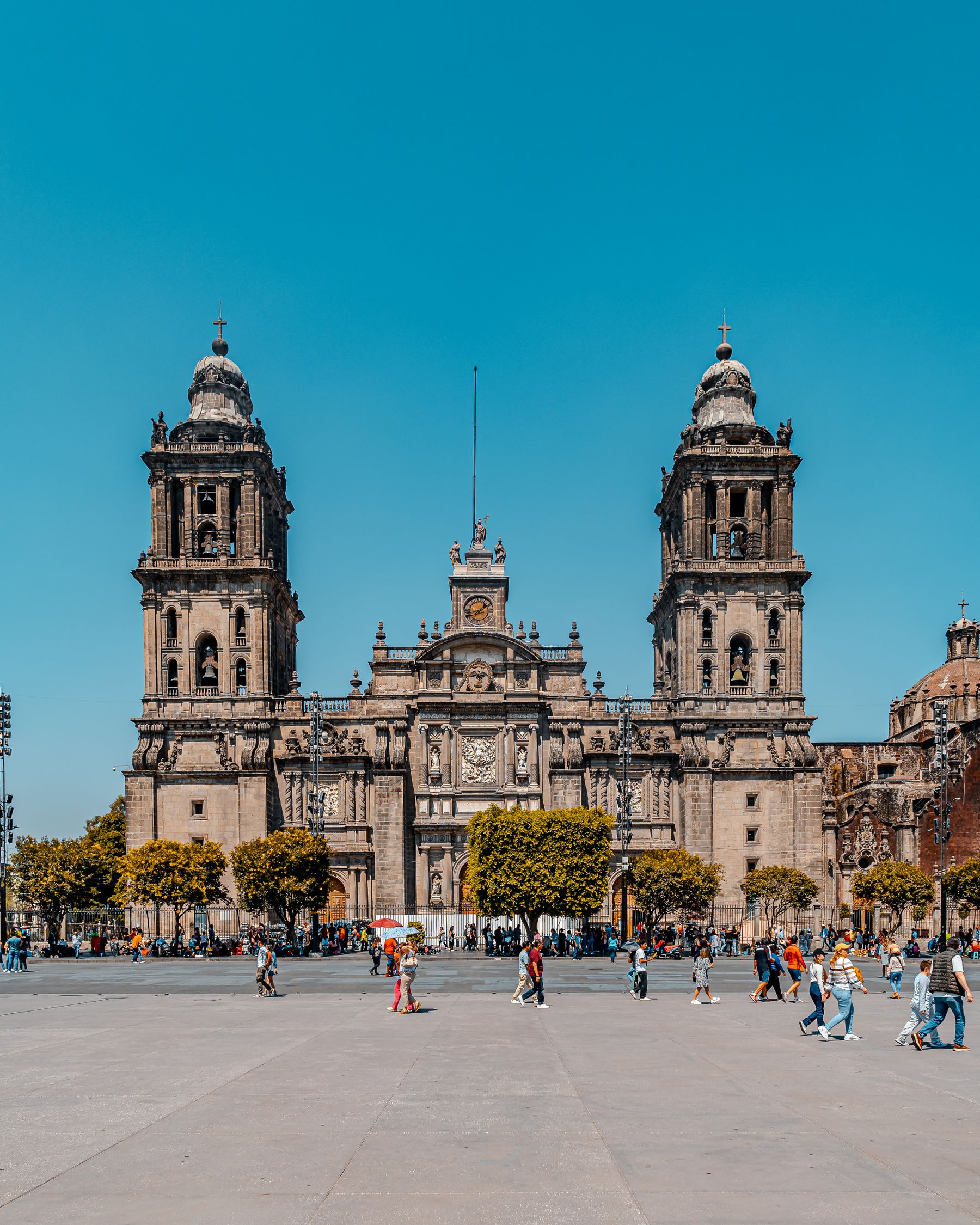 The Metropolitan Cathedral above a busy plaza in Mexico City
