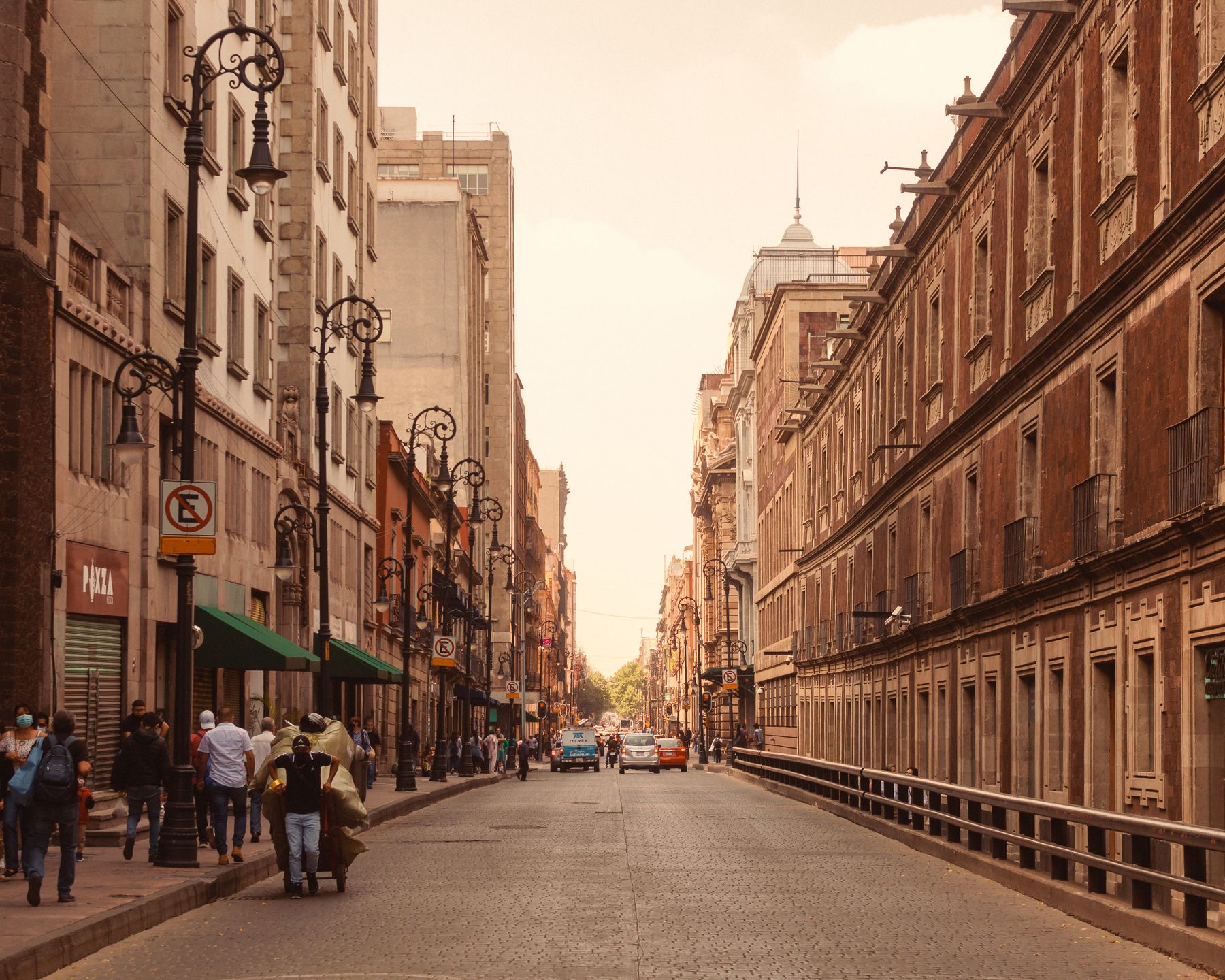 Pedestrians and vintage architecture on a street in Ciudad de Mexico