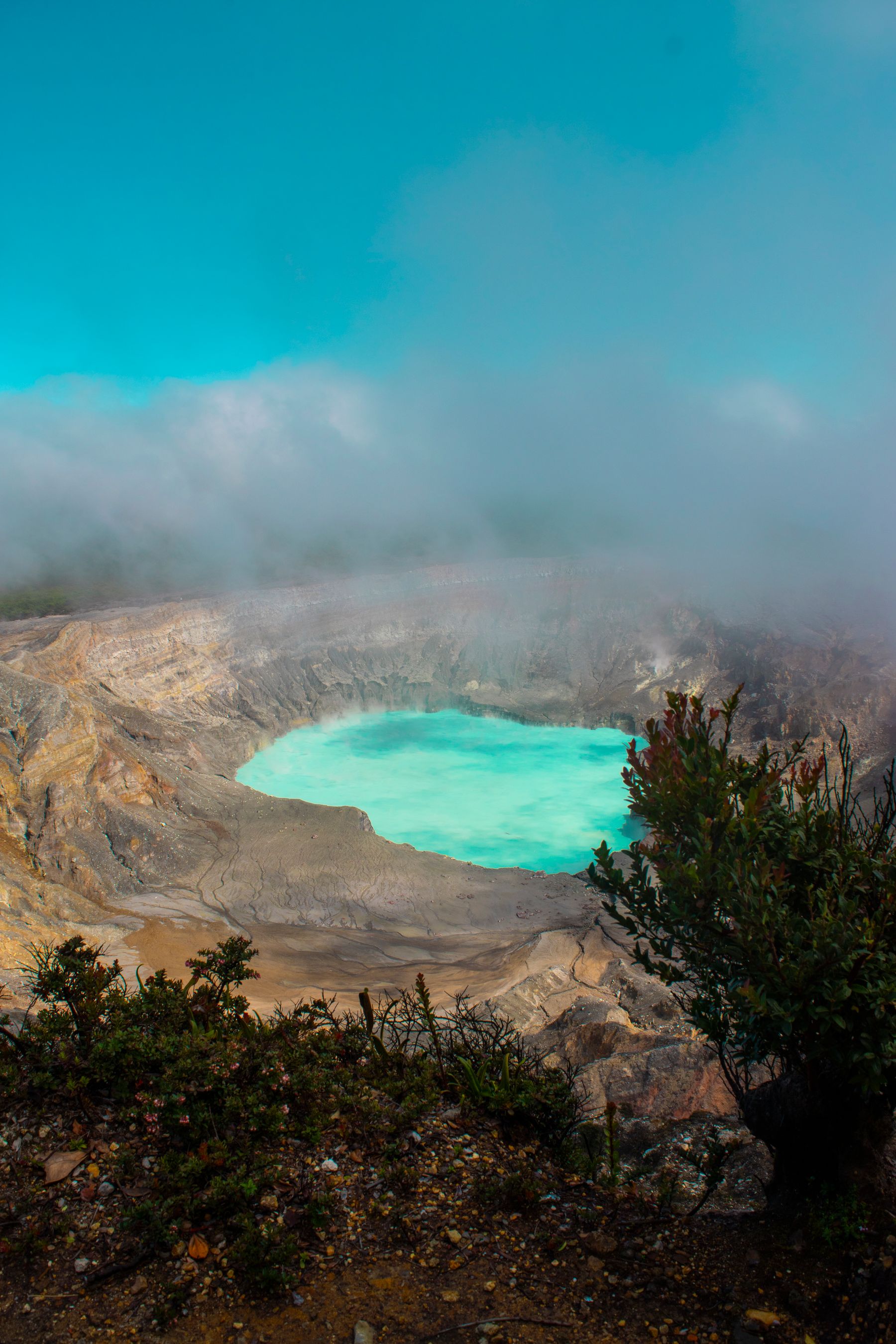 Aerial view of the turquoise crater lake at Poas Volcano in Costa Rica