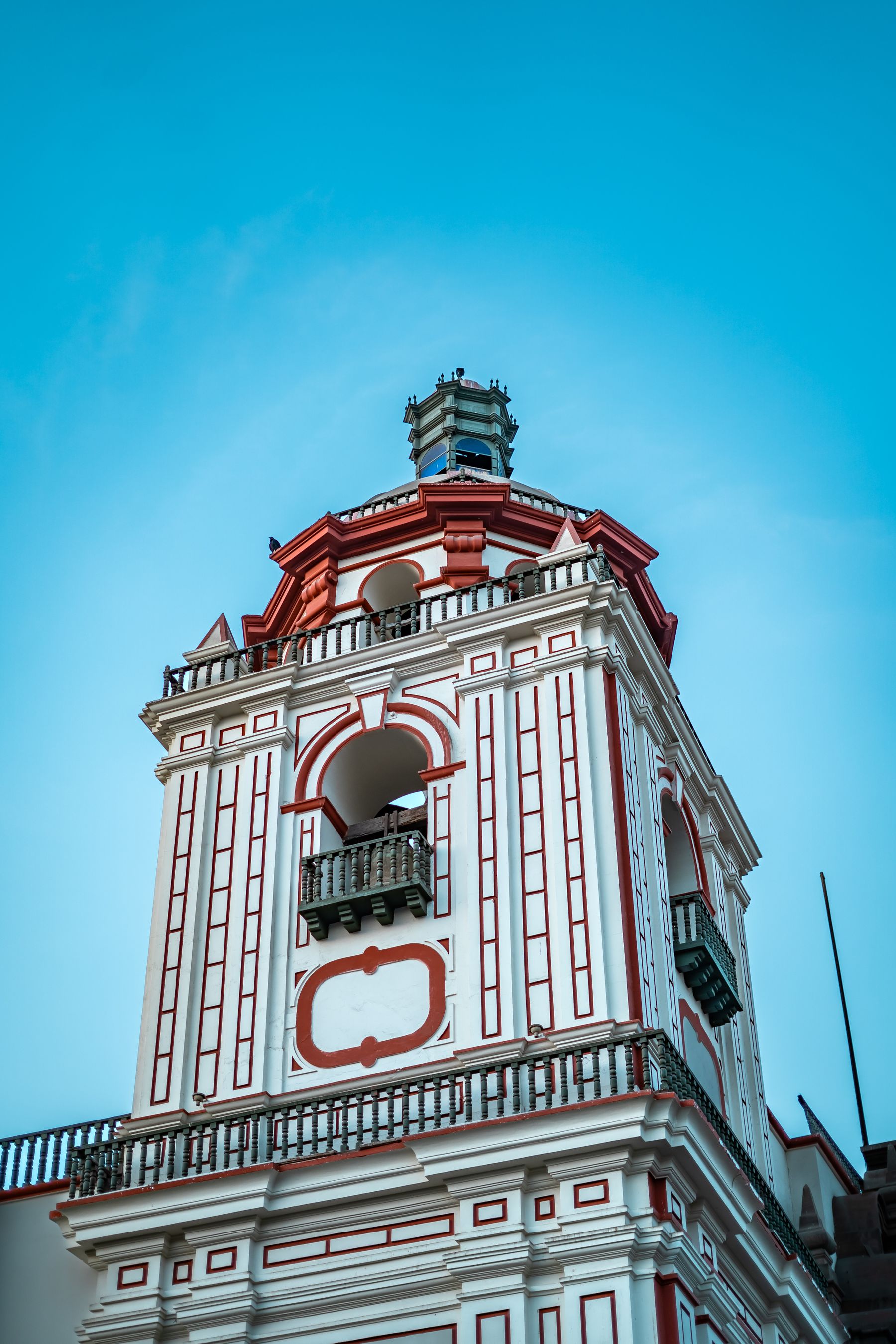 A baroque bell tower in Lima photographed on a clear day
