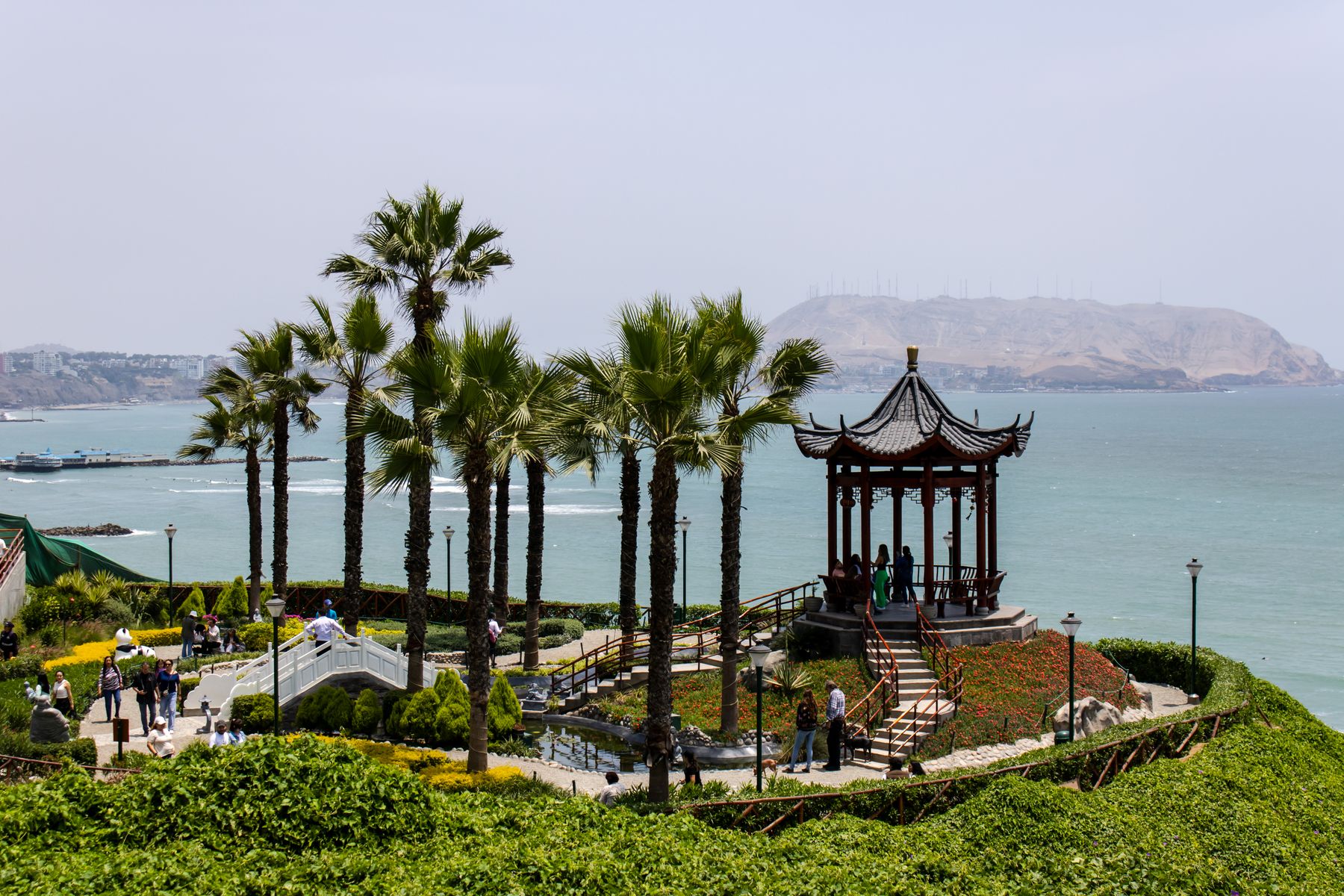 A gazebo among palm trees on the Lima clifftop overlooking the Pacific