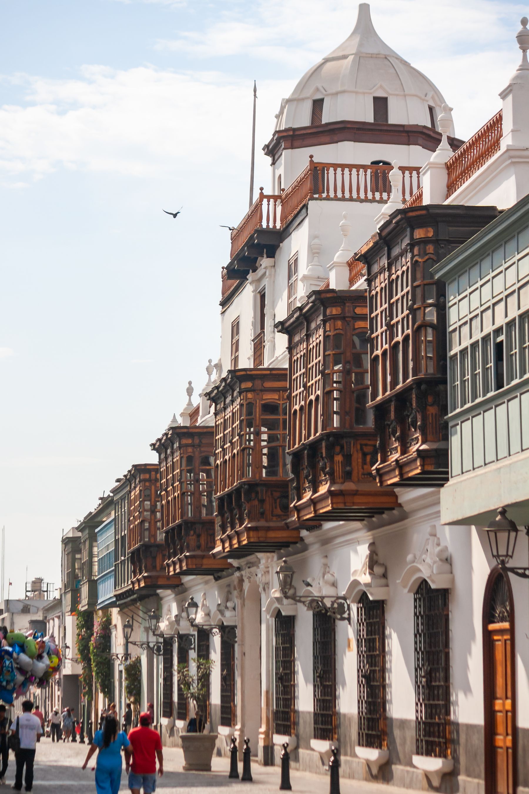 Historic wooden balconies lining a street in central Lima