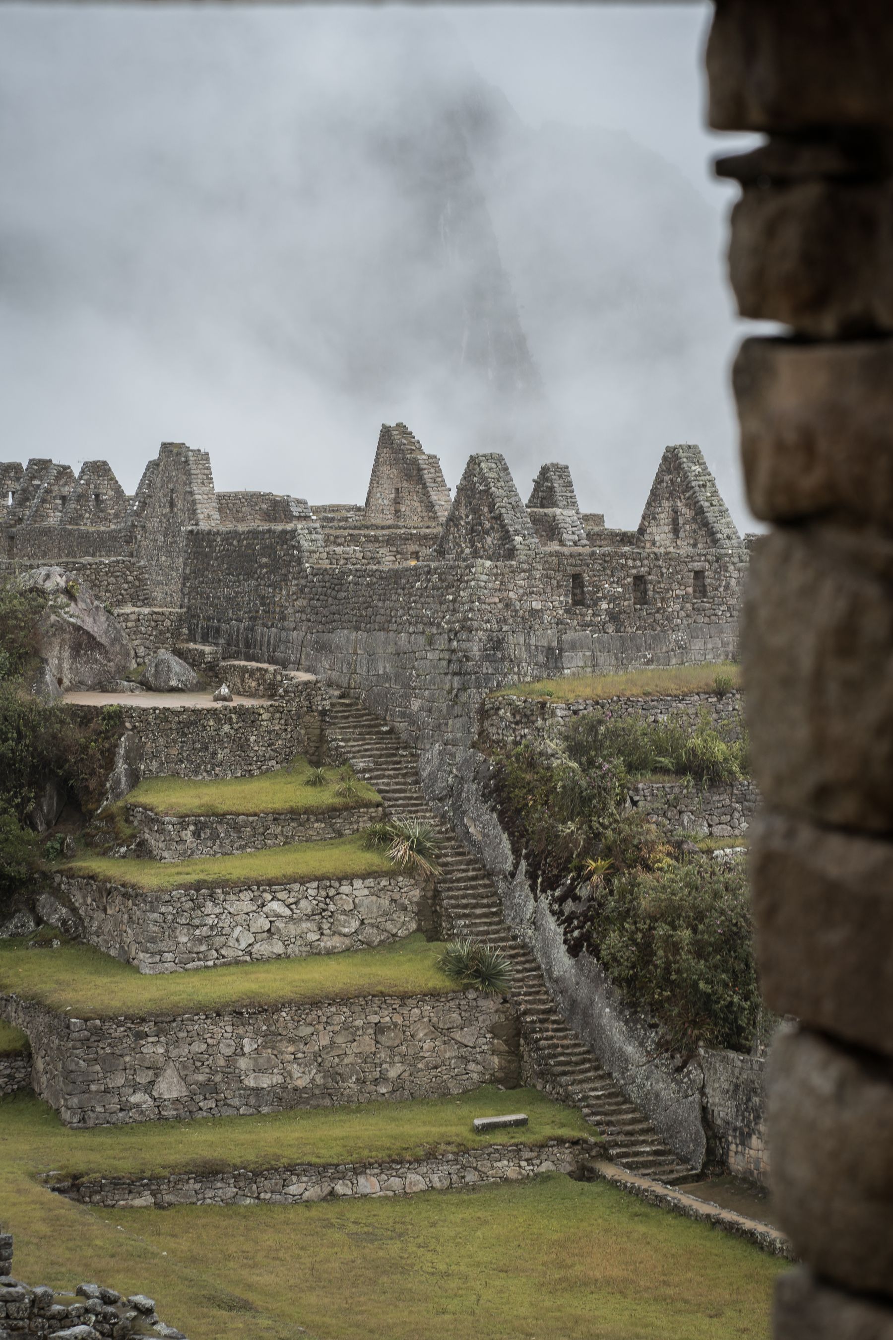 A misty view of the ancient ruins of Machu Picchu in Cusco, Peru