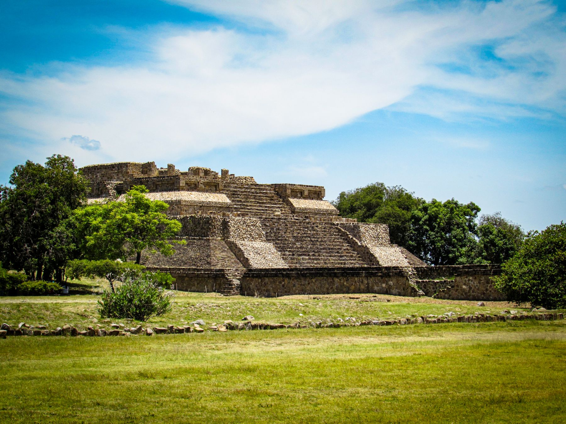 The Monte Alban pyramid in Oaxaca under a clear blue sky
