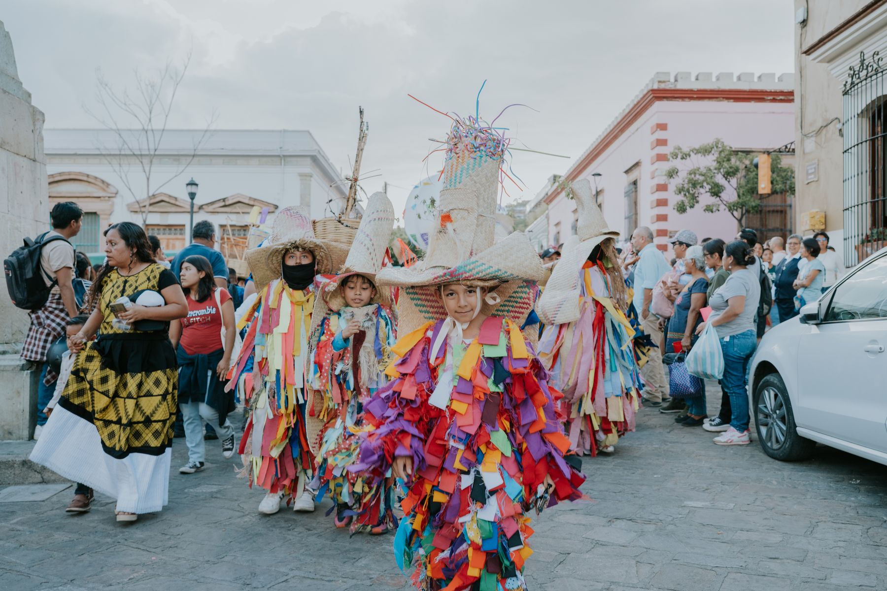 A street parade in Oaxaca with traditional Mexican costumes