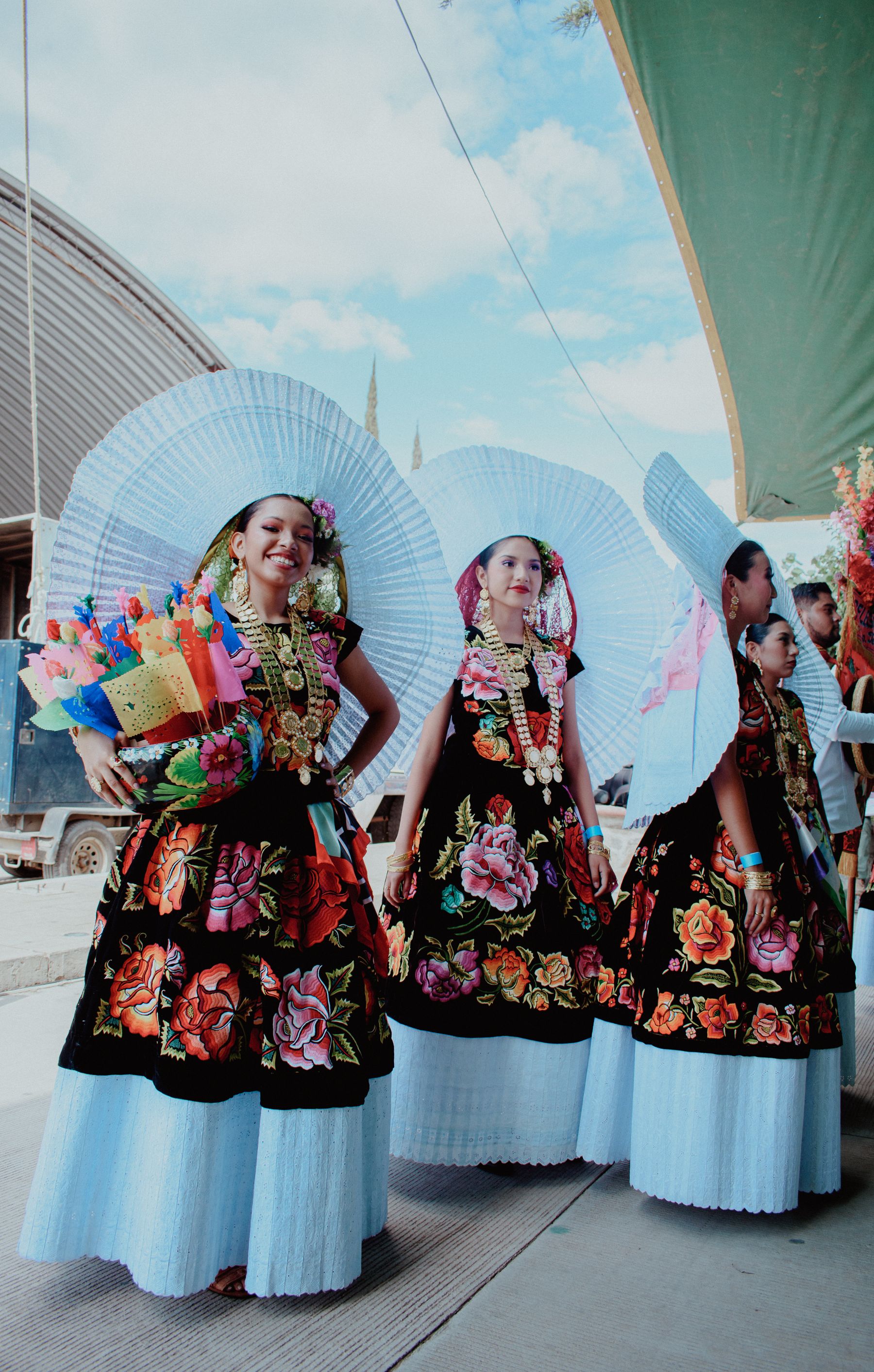 Women in colourful traditional Oaxacan dresses during a festival