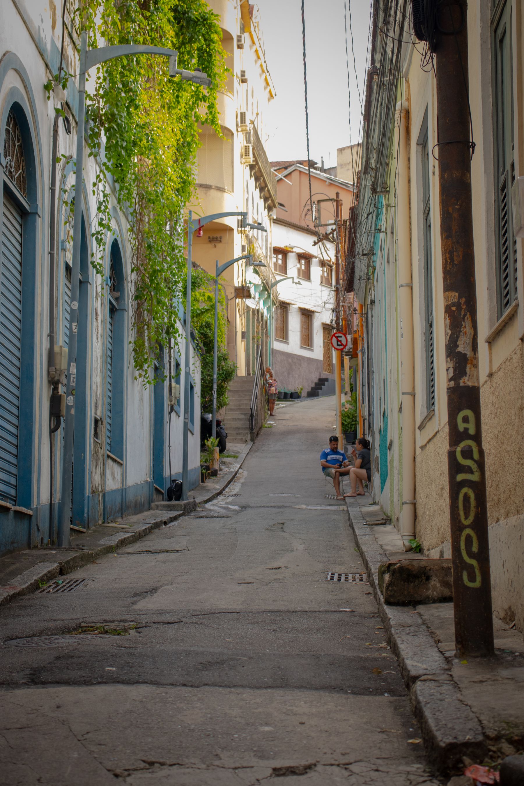A colourful street in the Santa Teresa neighbourhood of Rio de Janeiro with greenery and old houses