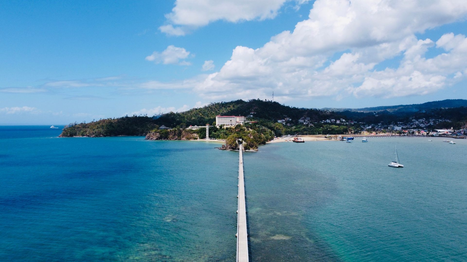 Aerial view of the Samana bridge across blue water, Dominican Republic