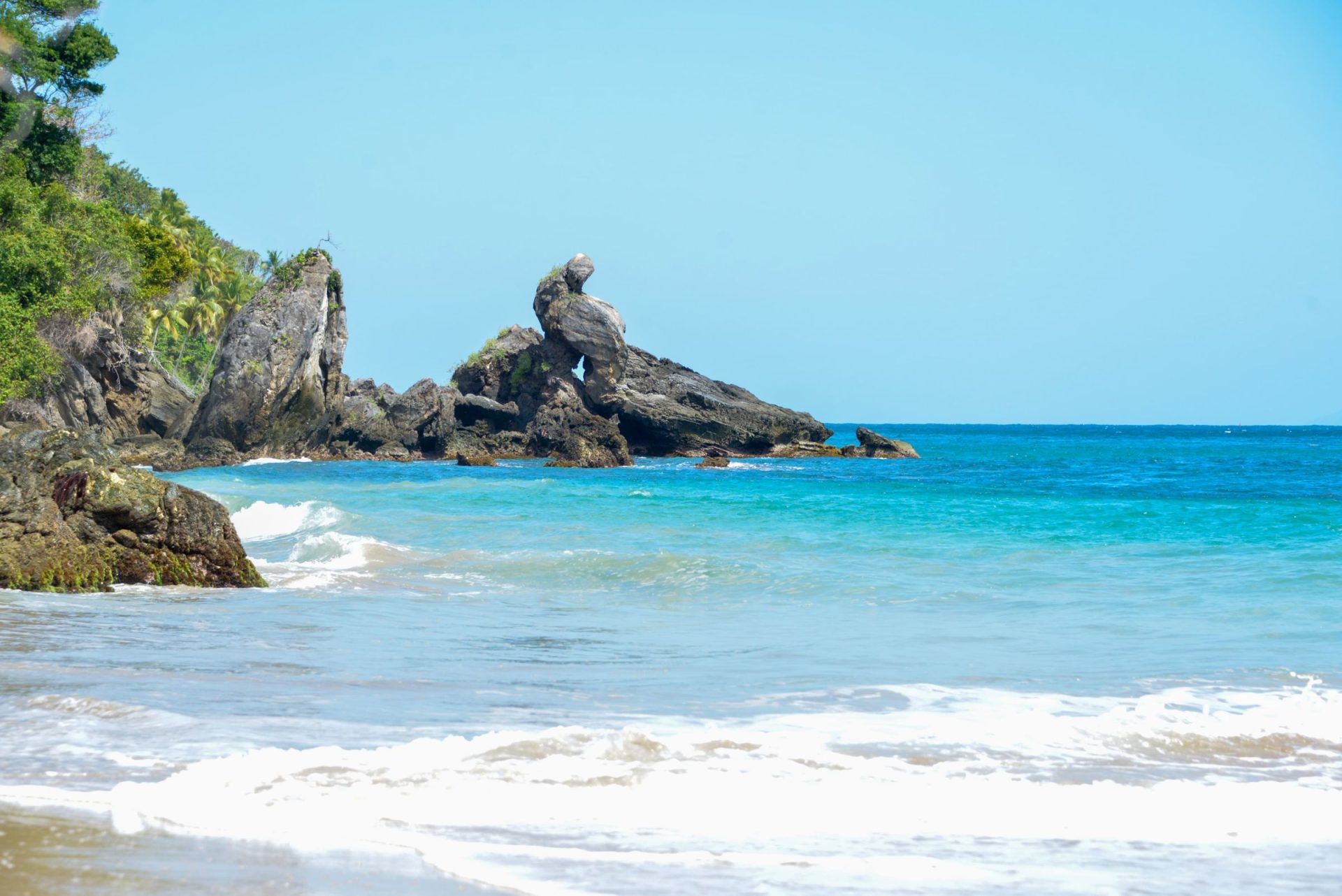 Beach and rocky cliffs on the Samana coastline, Dominican Republic