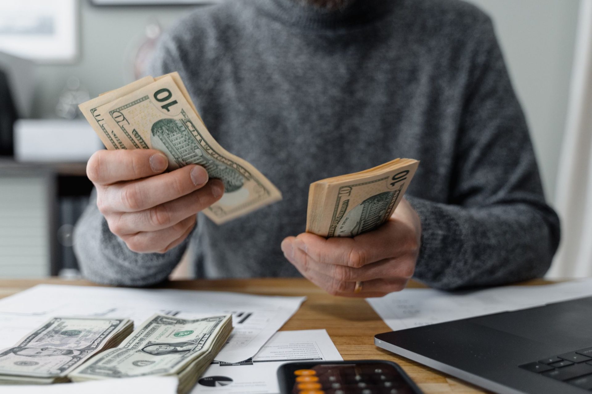 Hands counting out banknotes