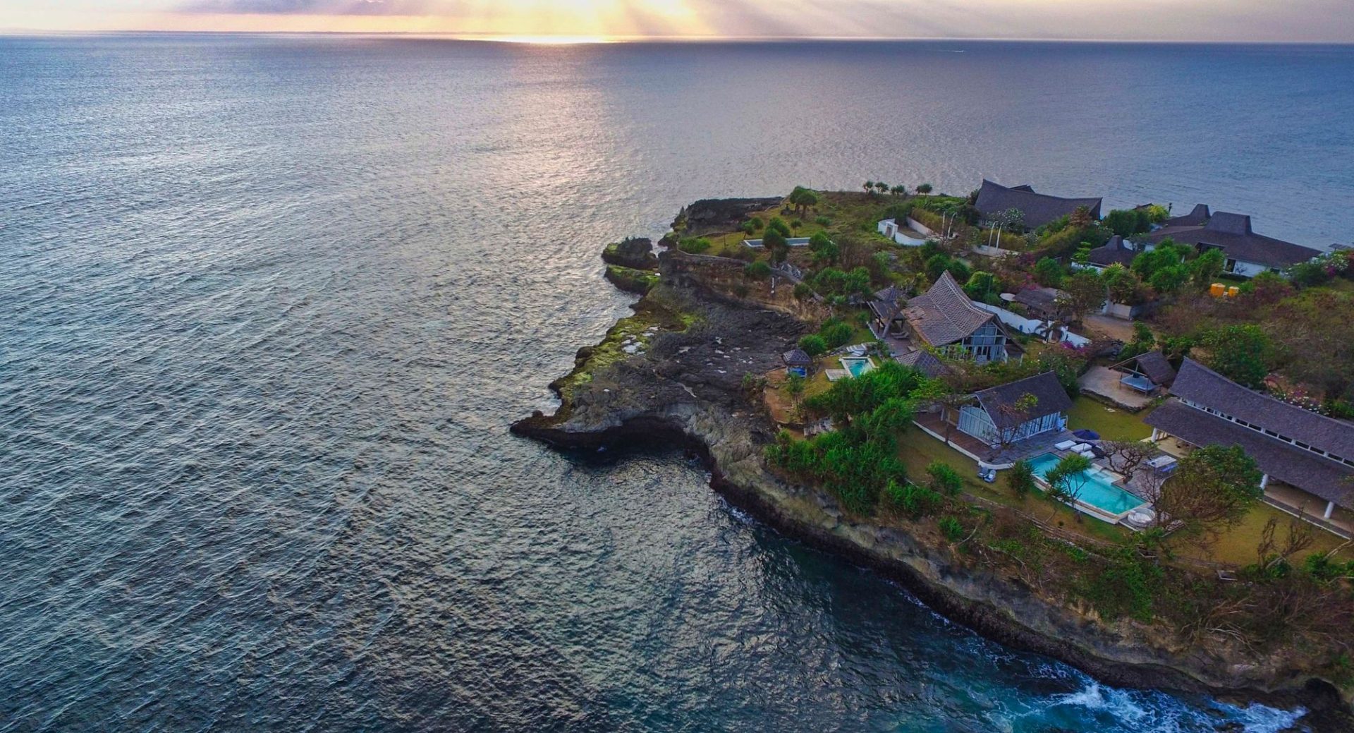 A tropical island seen from the air in the late afternoon