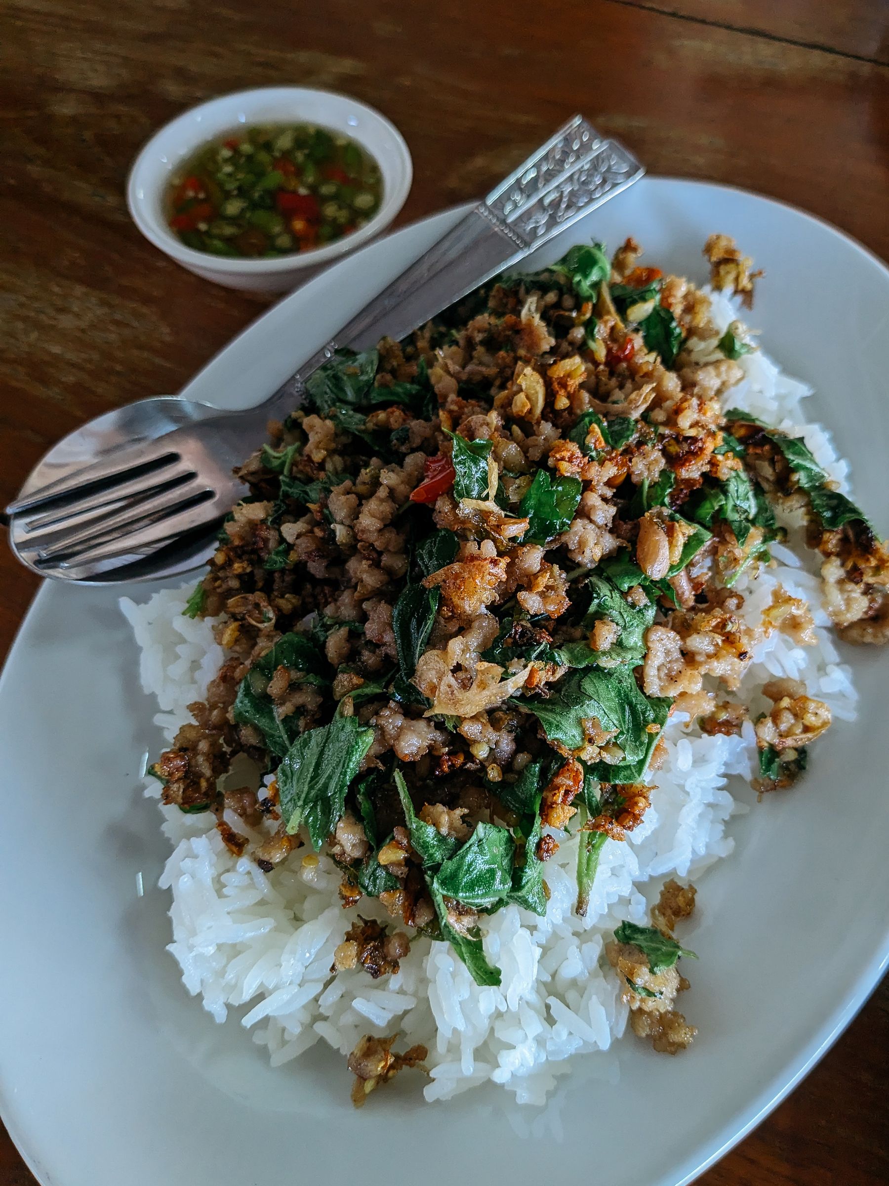 Minced pork with holy basil served over steamed rice