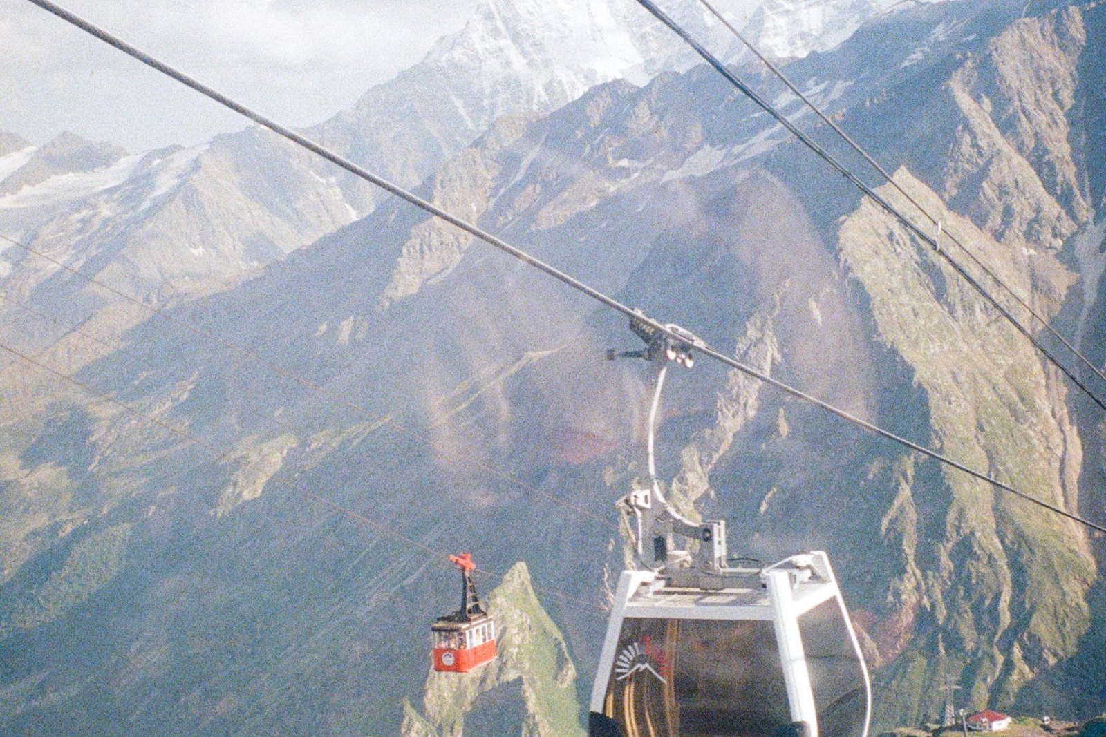 A cable car crossing high above the coast