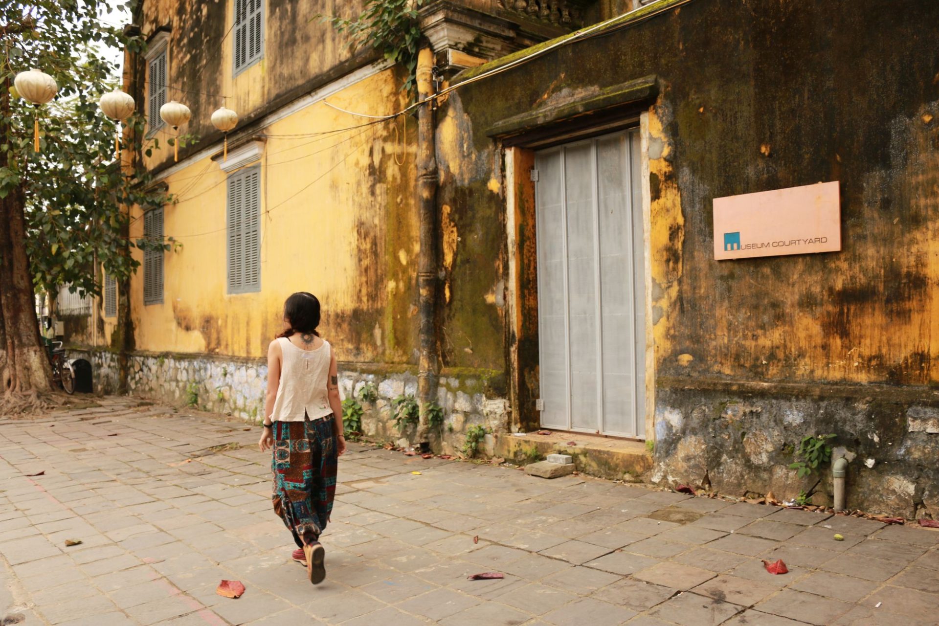 A quiet lane of old buildings at the end of the day